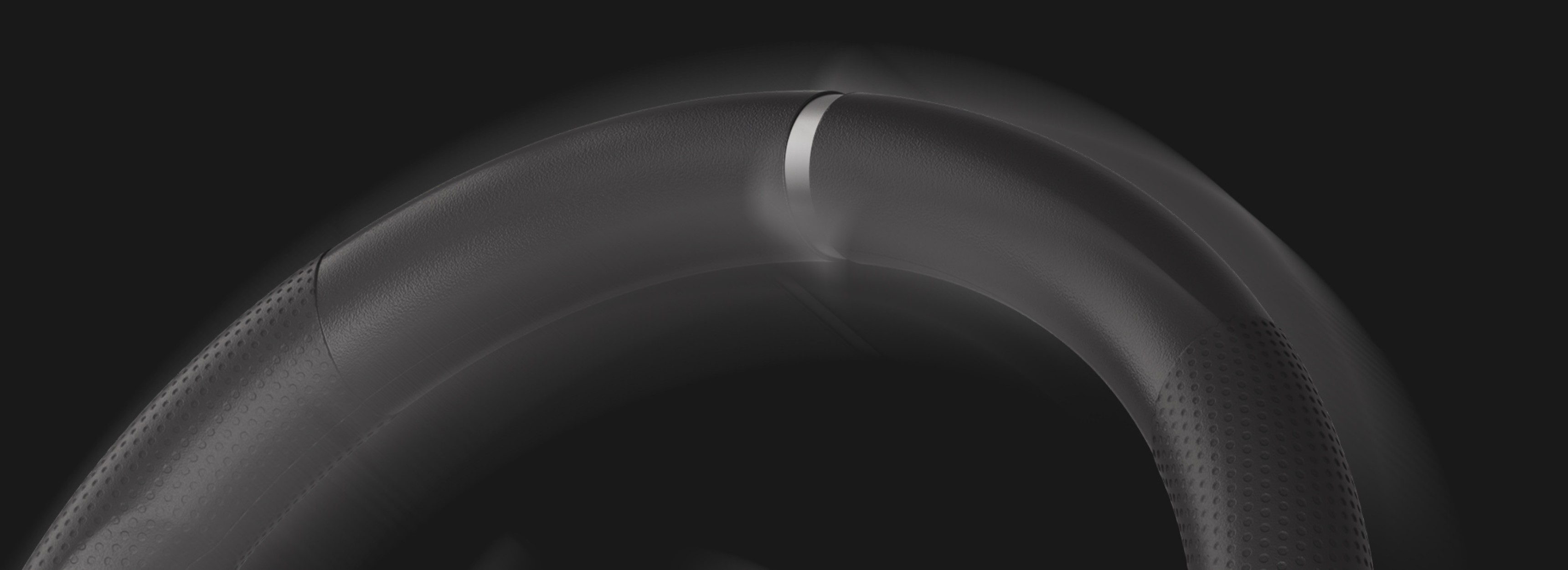 Close-up of the Genesis Seaborg 400 racing wheel, featuring a sleek design and textured grip for enhanced control