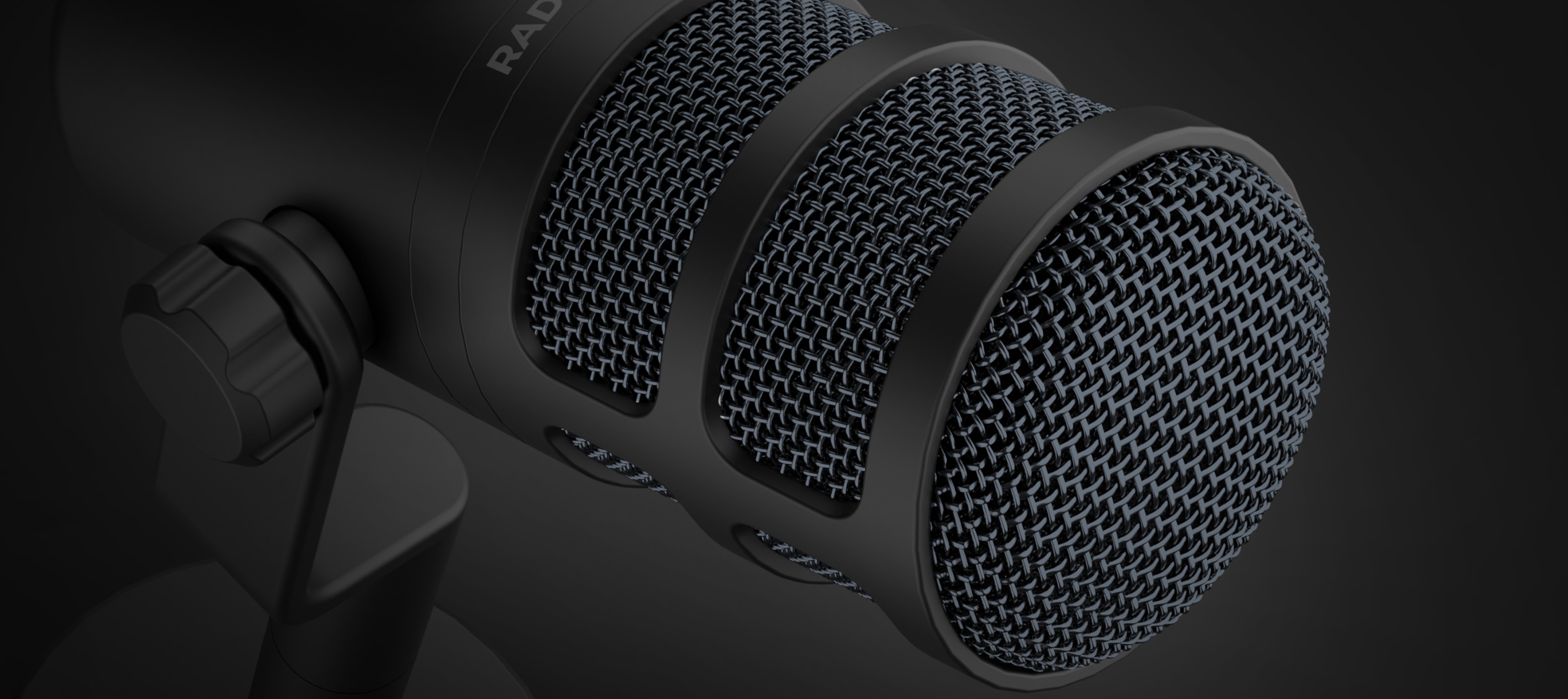 Close-up of the Genesis Radium 350D dynamic USB microphone, featuring a black finish and textured mesh grille