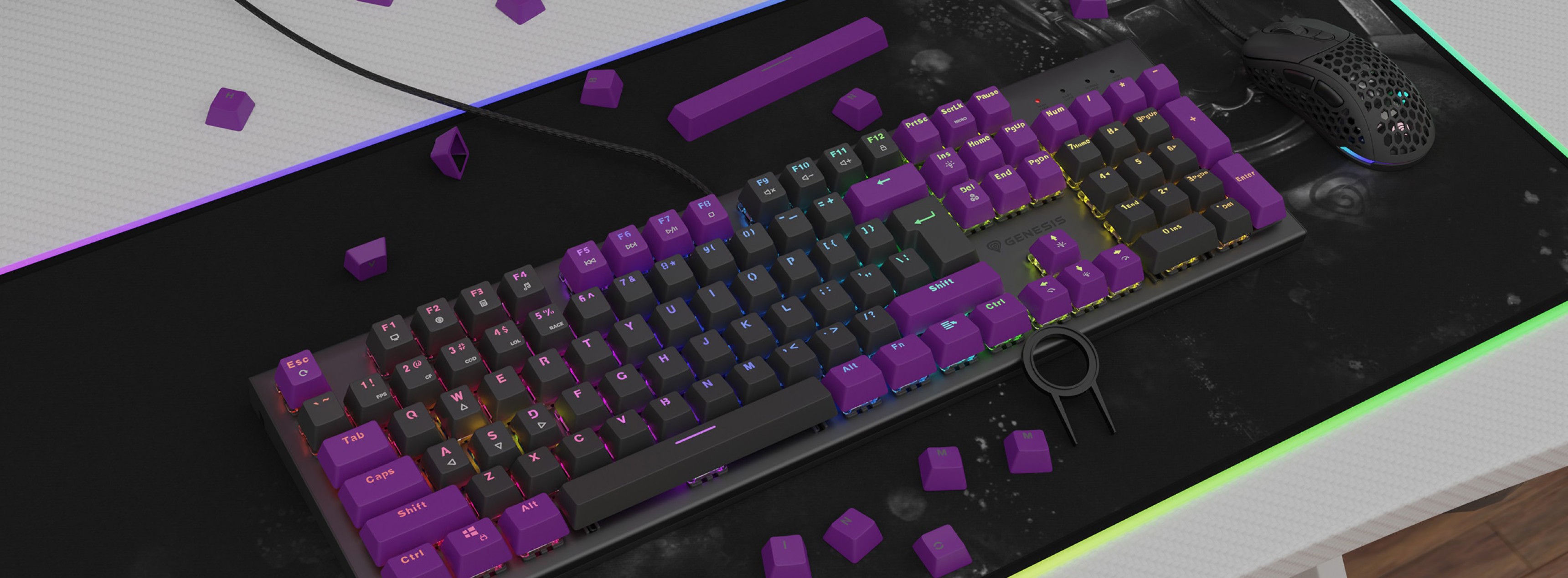 Purple double shot keycaps on a keyboard with RGB lighting, set on a dark mouse pad with scattered additional keycaps