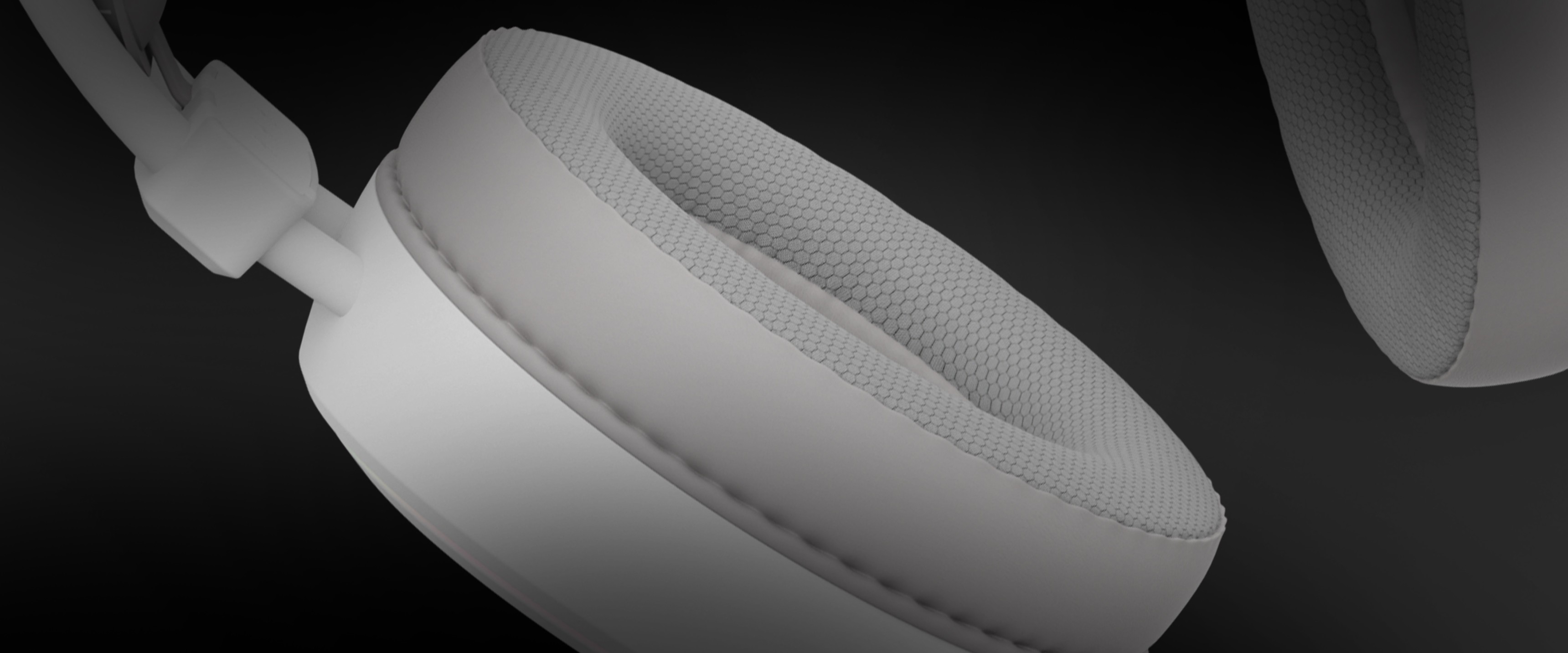 White over-ear headphones with RGB lighting and a microphone, featuring a textured ear cushion for comfort