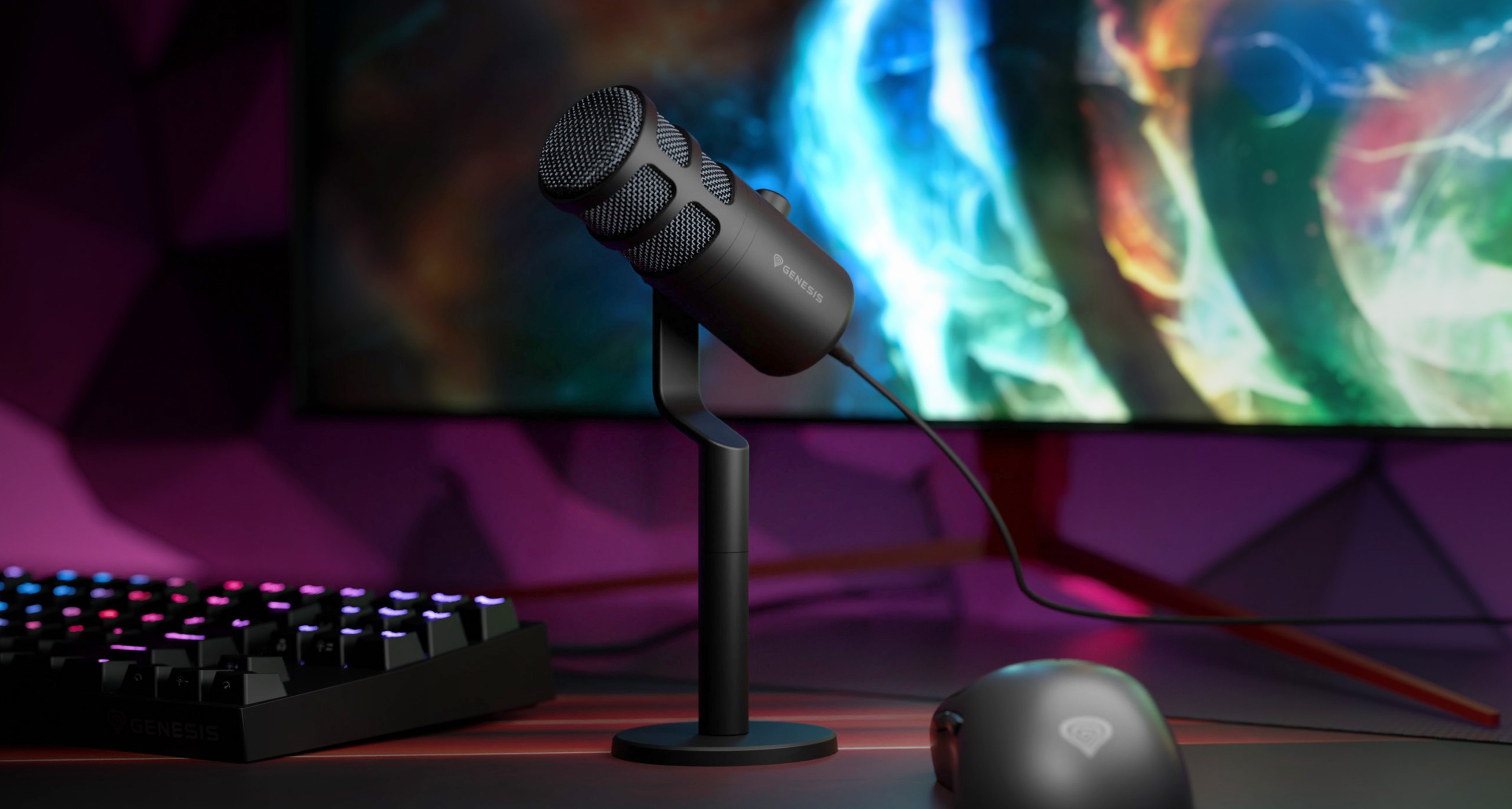 USB dynamic microphone on a stand, with a colorful background and a gaming keyboard and mouse nearby