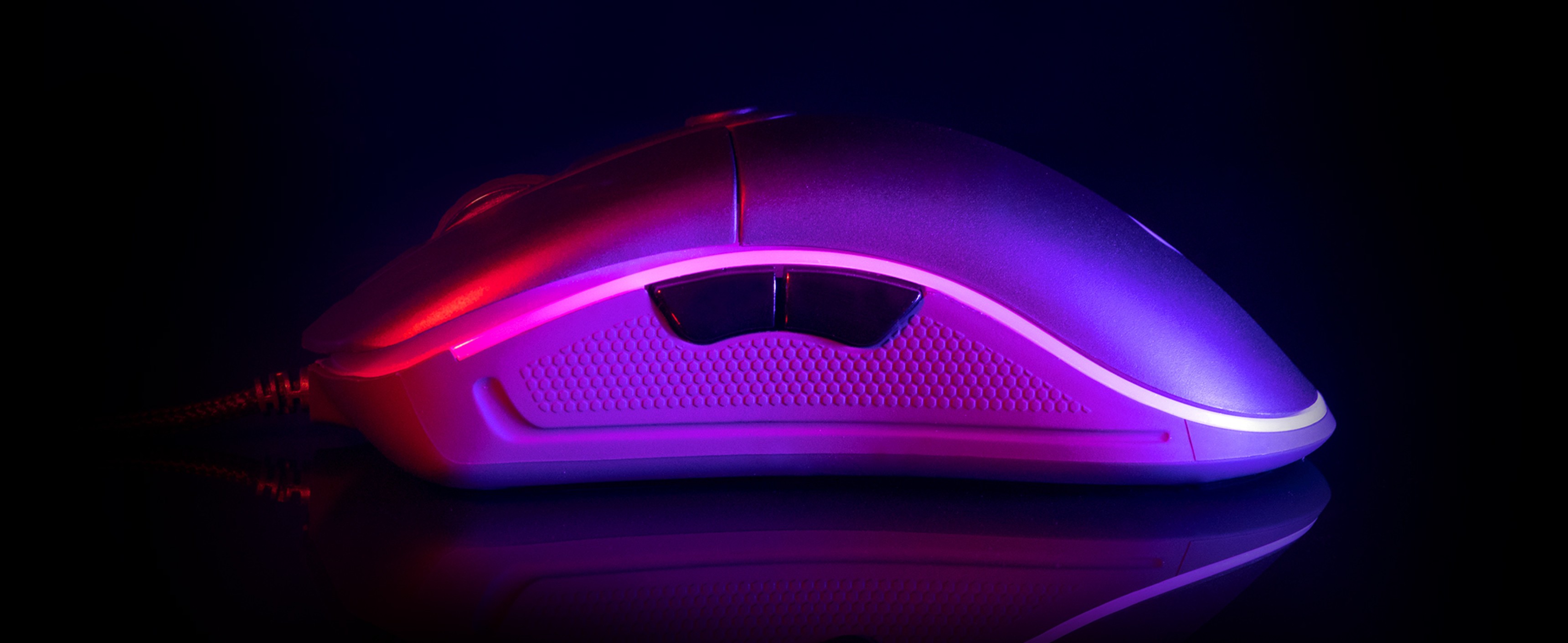 Side view of the Genesis Krypton 510 gaming mouse with RGB lighting, showcasing its sleek design and 8000 DPI capability