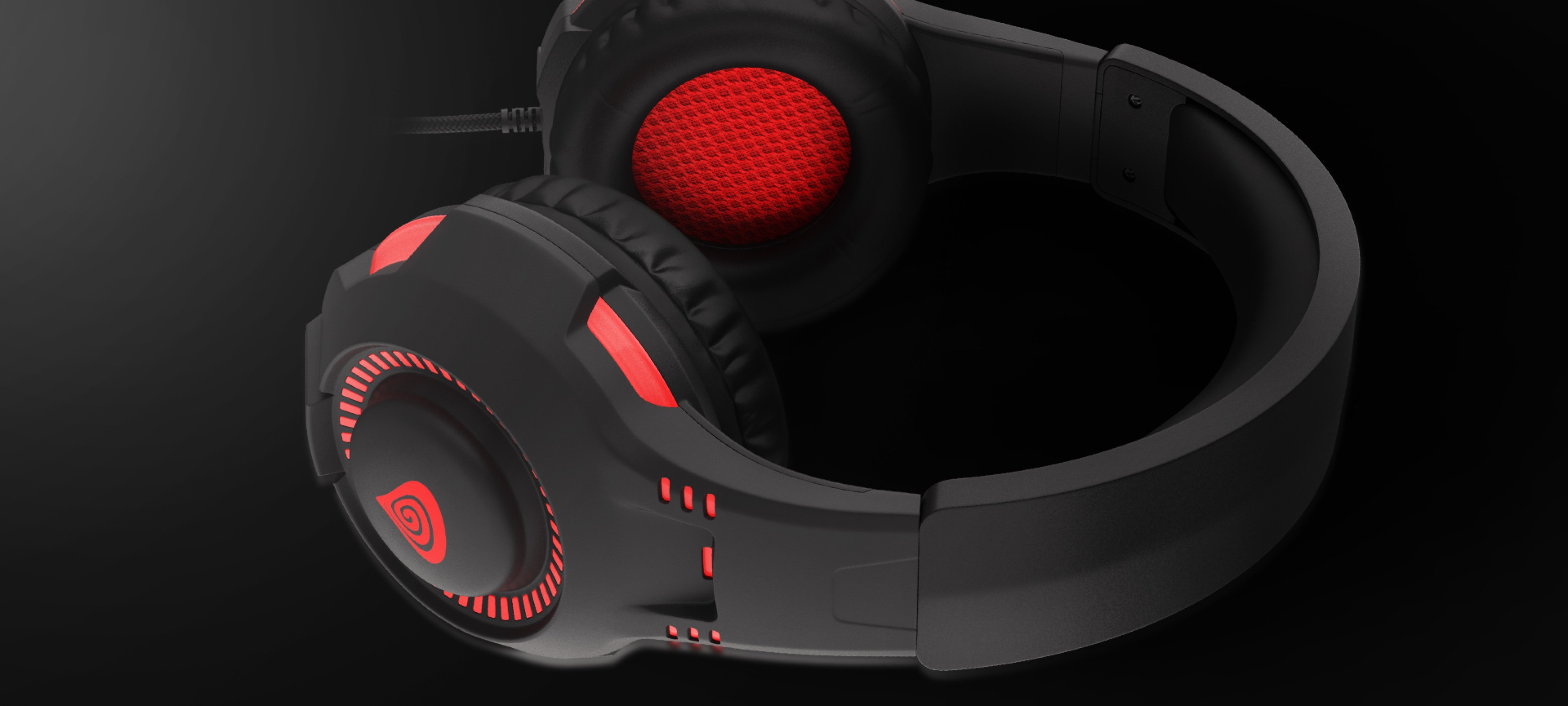 Black and red wired gaming headphones with a USB connection and a microphone, featuring illuminated ear cups