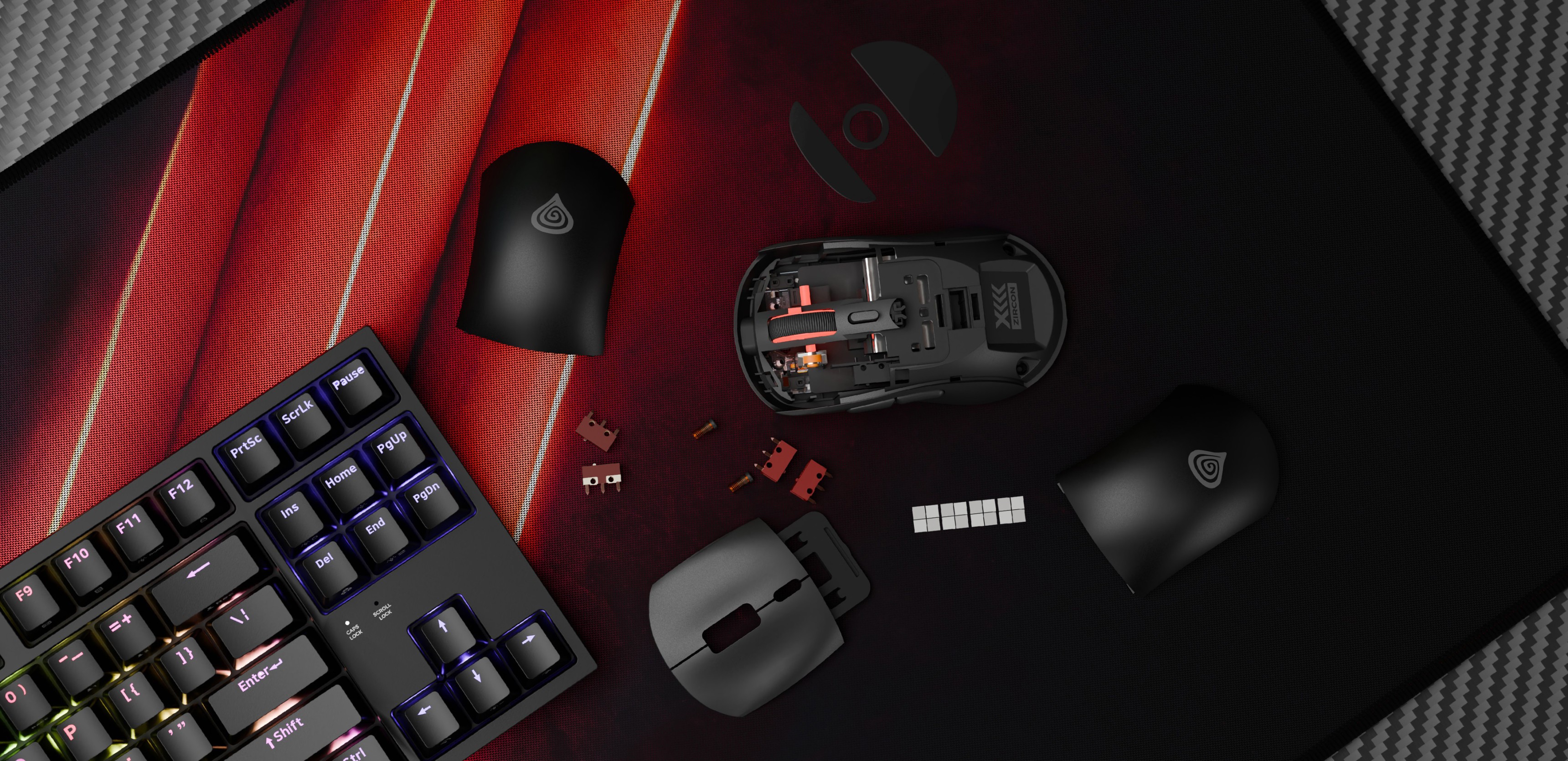 Wireless gaming mouse Genesis Zircon XIII in black, with removable covers and components on a textured mouse pad alongside a keyboard