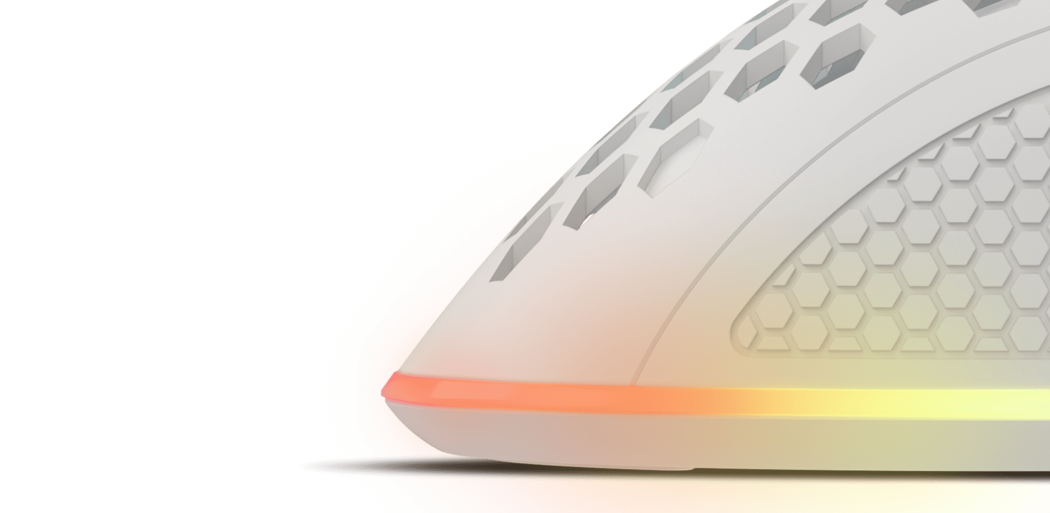 White RGB gaming mouse with programmable features and a textured side, showcasing a honeycomb design and colorful lighting