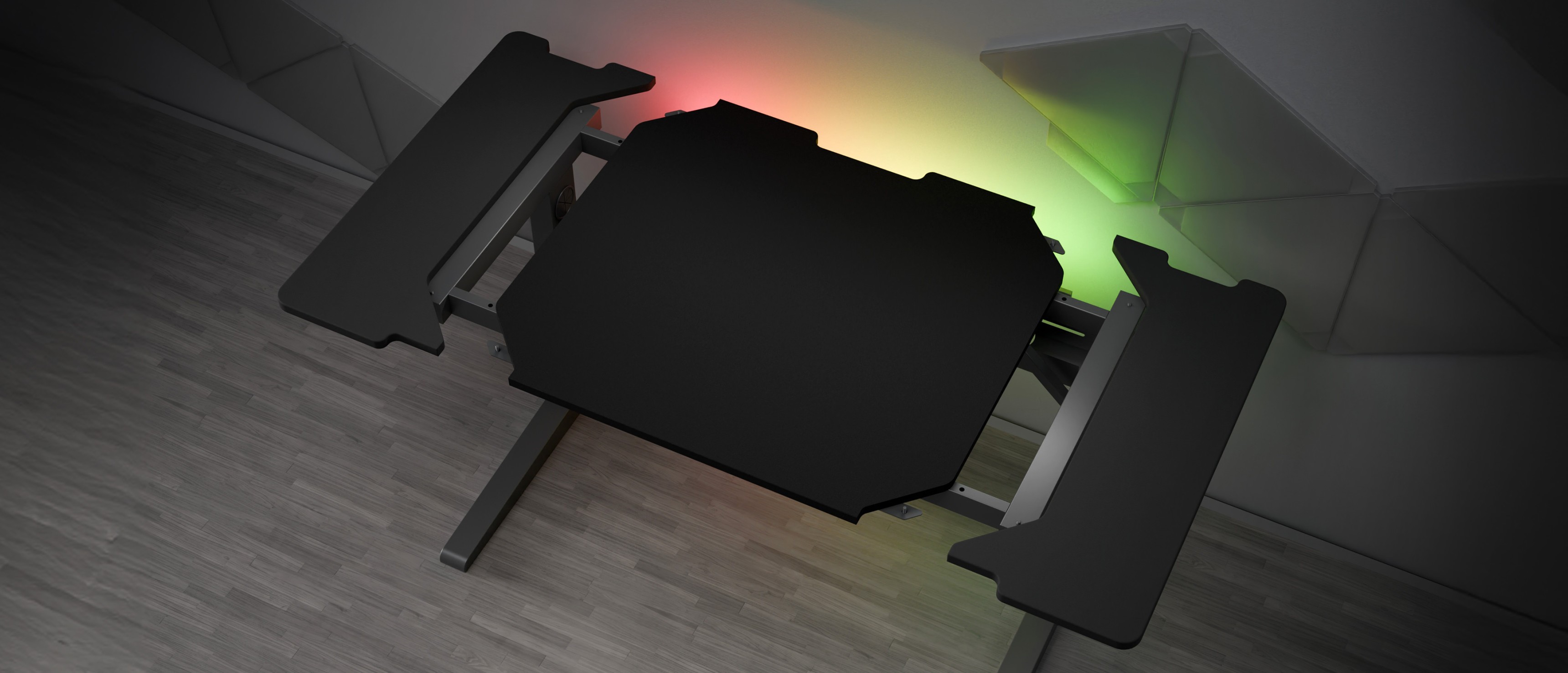 Modular gaming desk with a sleek black surface and customizable RGB lighting on the edges
