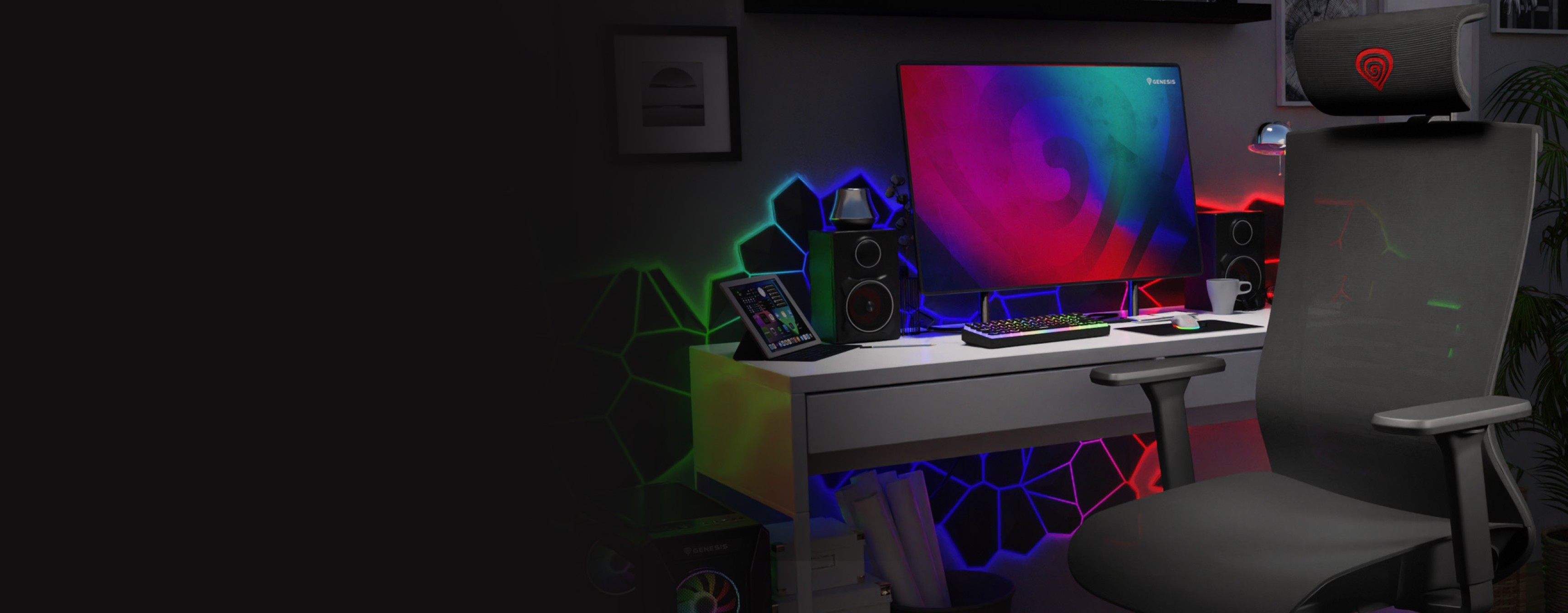 Ergonomic black gaming chair, Genesis Astat 700 G2, in a colorful, modern workspace with a monitor and gaming accessories