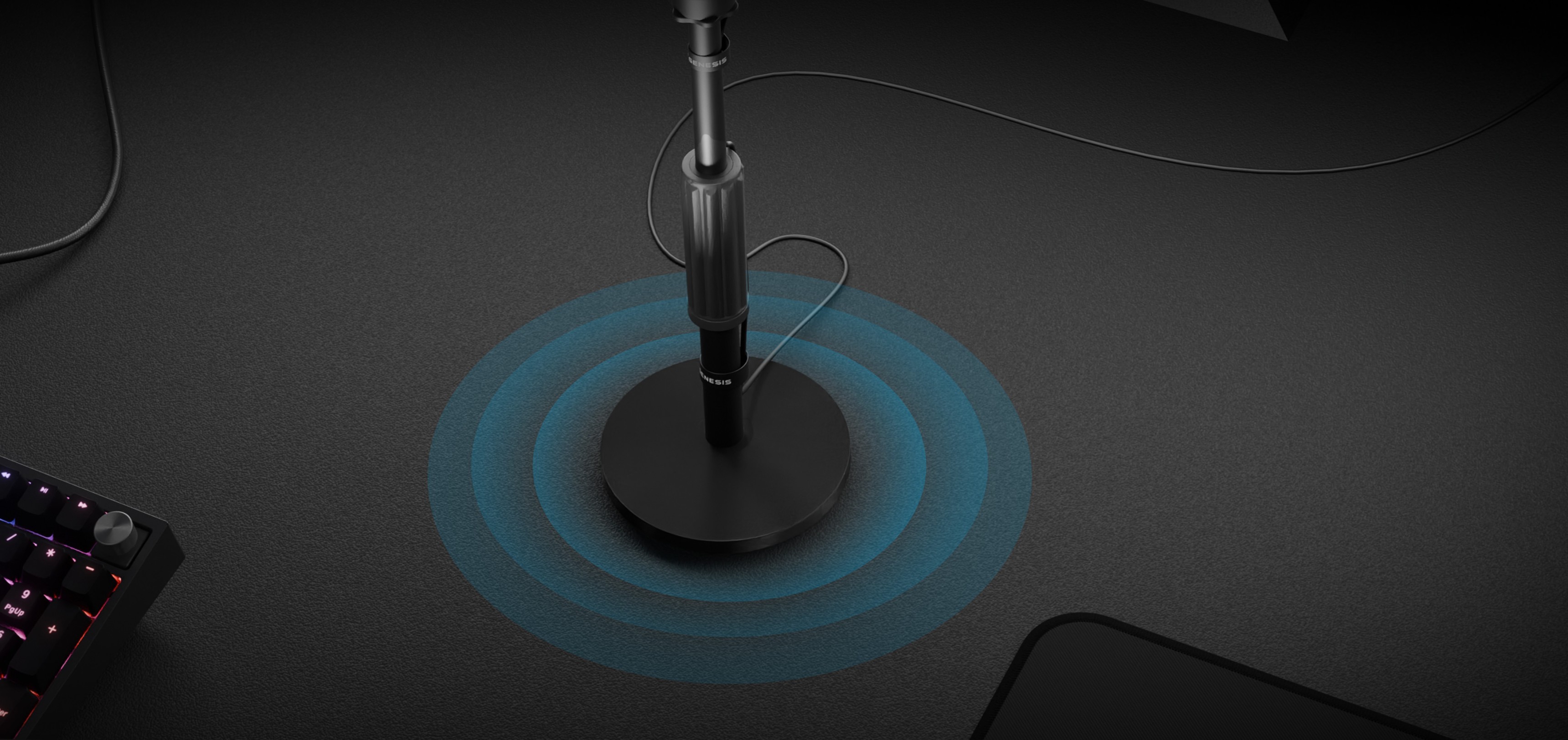 Microphone stand Genesis Thulium 350D on a desk with audio wave graphics, featuring a sleek black design