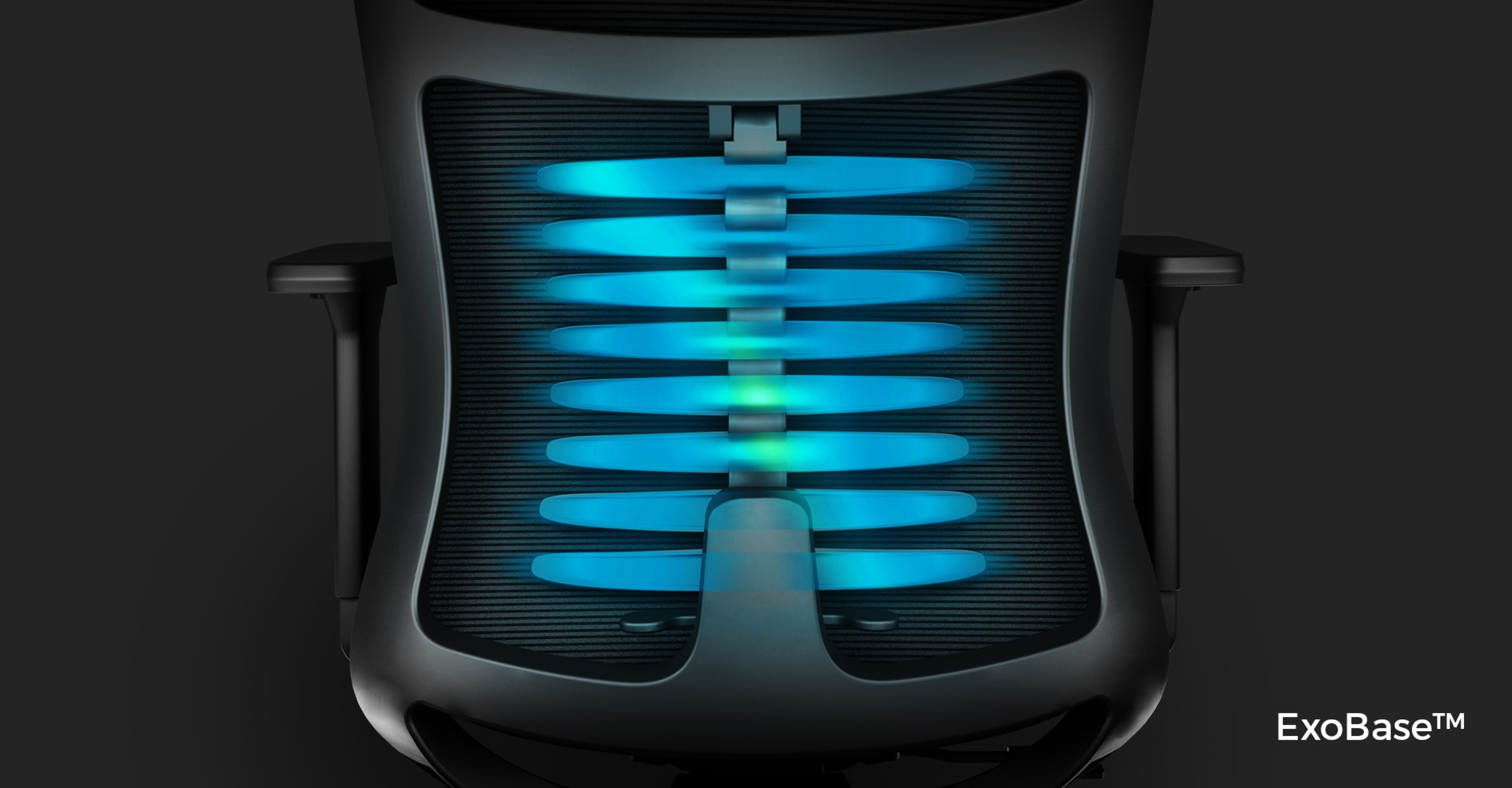 Top view of the ergonomic Genesis Astat 700 G2 black chair, showcasing its blue ExoBase™ spine support system