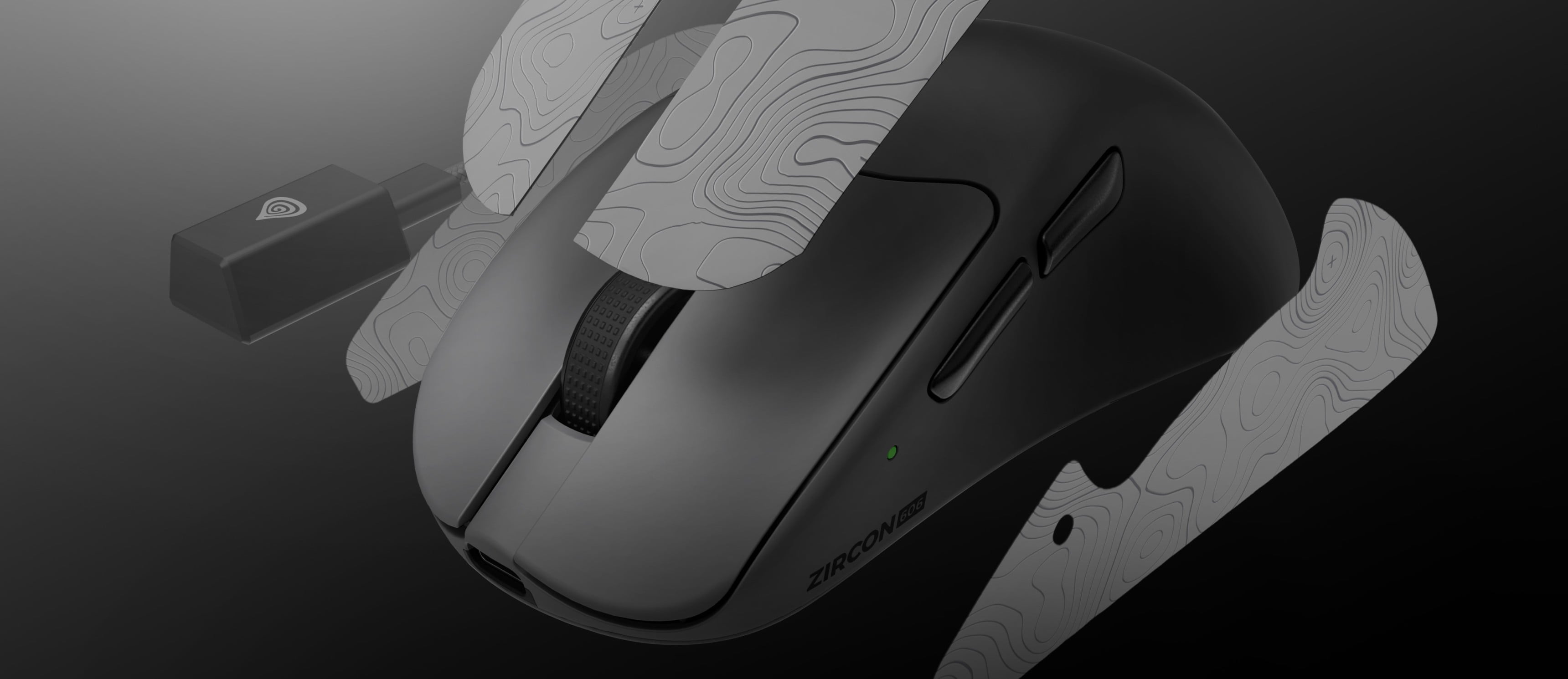 Gaming mouse with a textured surface and a small wireless connection adapter.