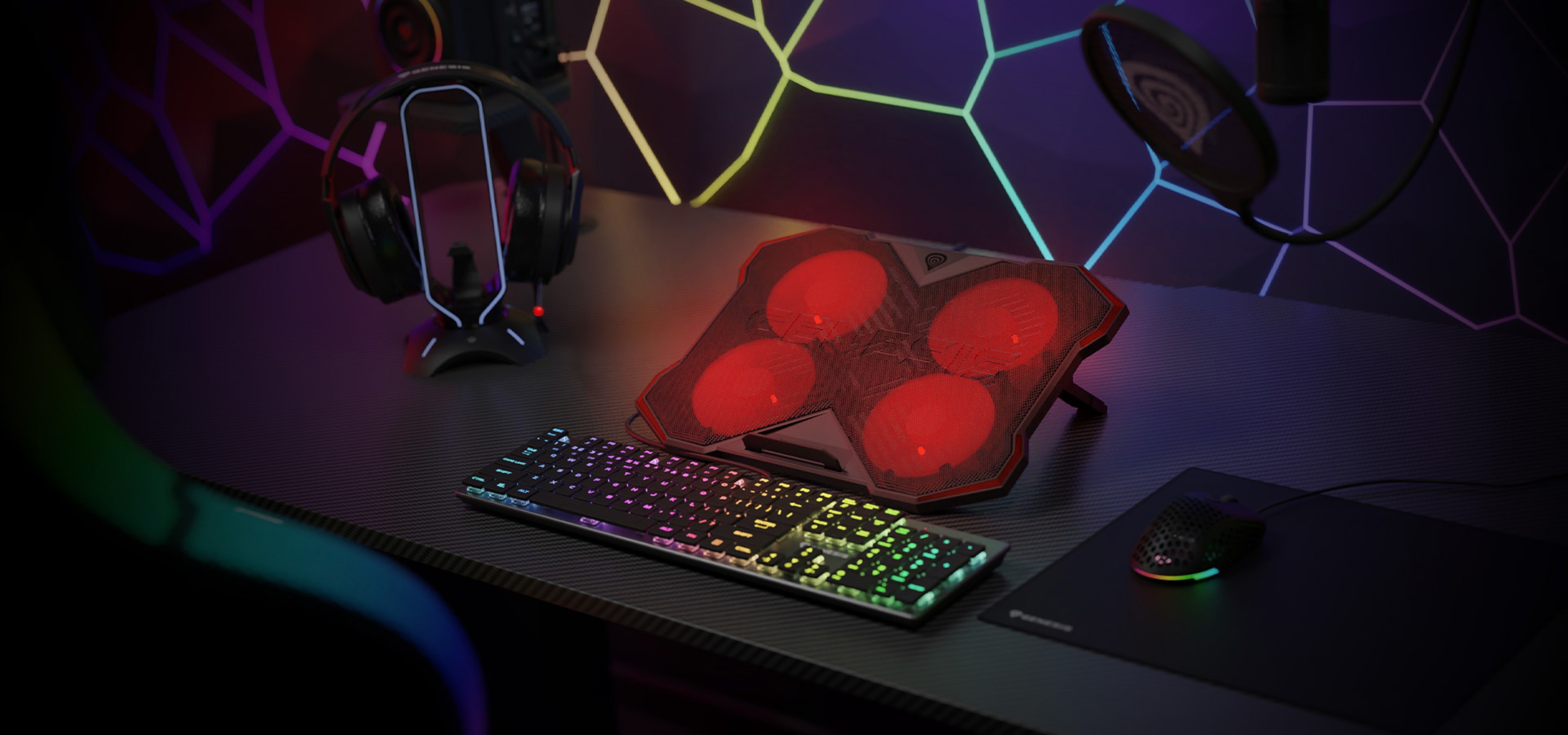 Cooling pad for laptops featuring four red fans, RGB lighting, and two USB ports, displayed on a gaming desk setup