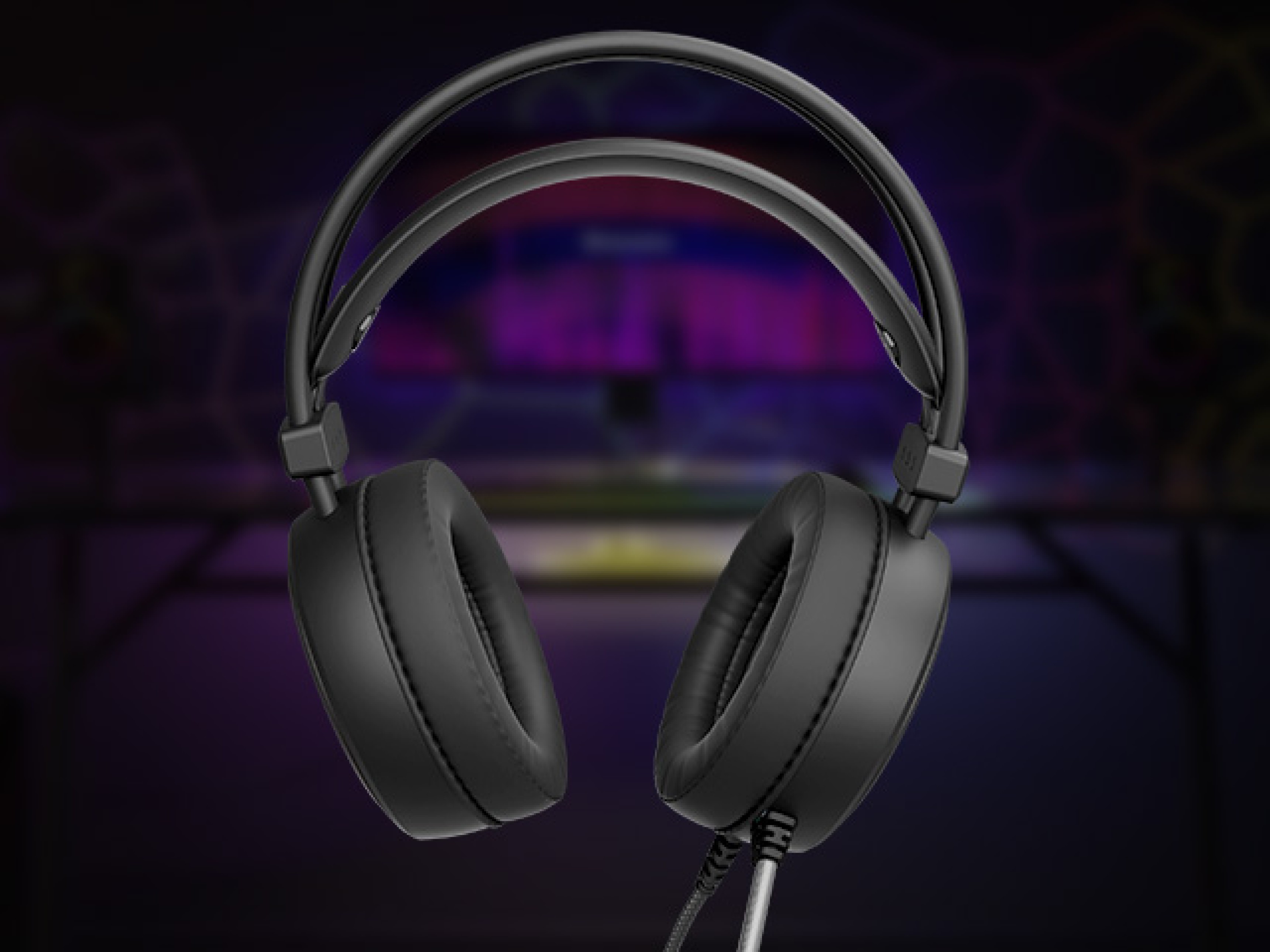 Headphones with thick ear cushions and a flexible headband against a colorful background.