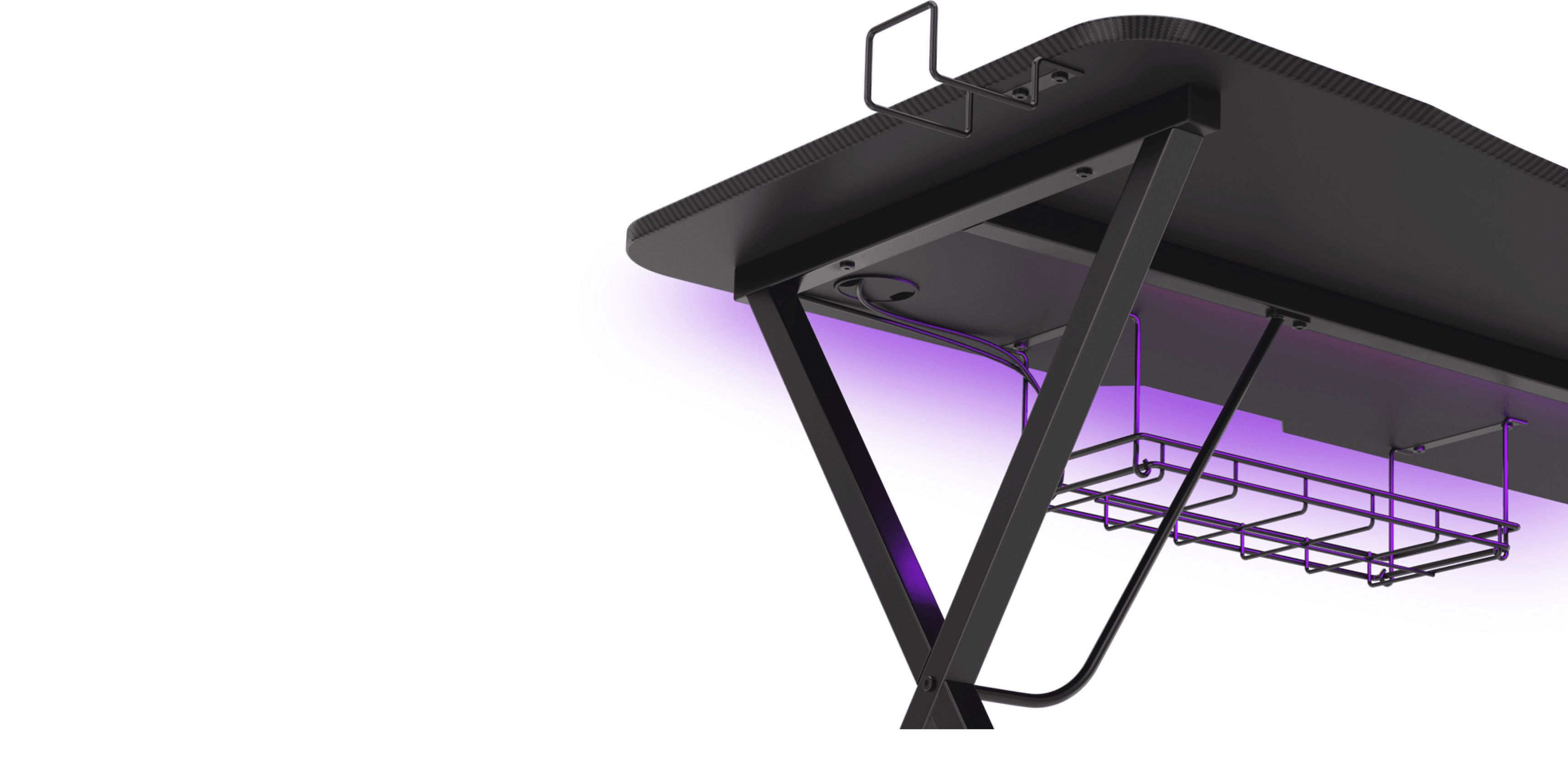 Black gaming desk featuring an RGB light strip underneath, with a cable management tray and sturdy metal legs