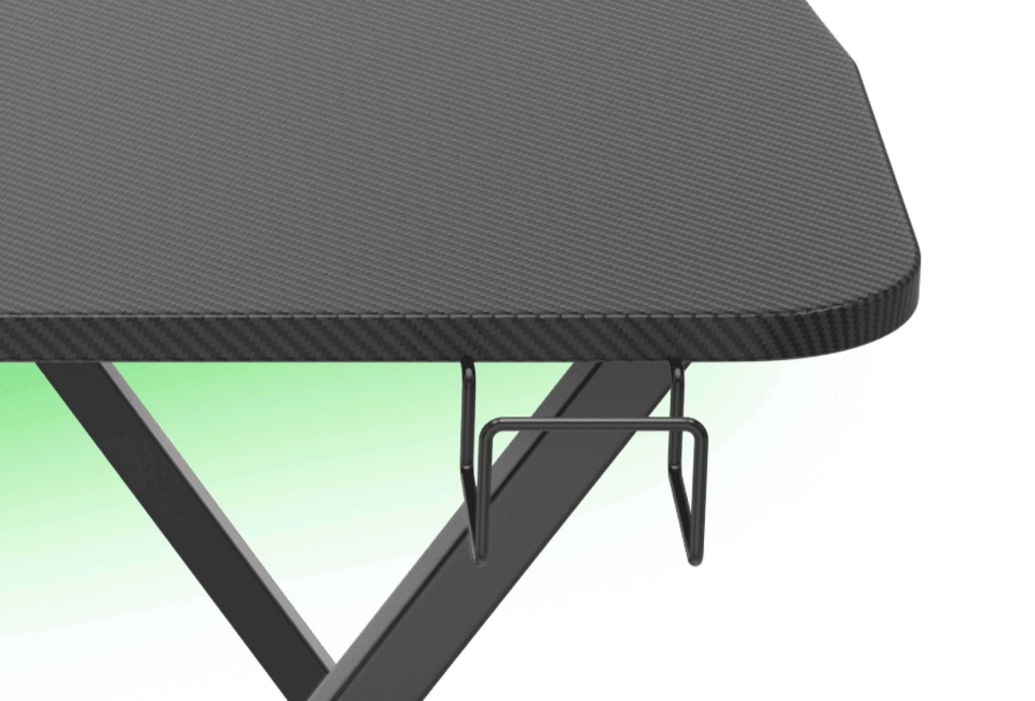 Black carbon fiber textured surface of the Genesis Holm 200 RGB gaming desk with a metal hook for accessories