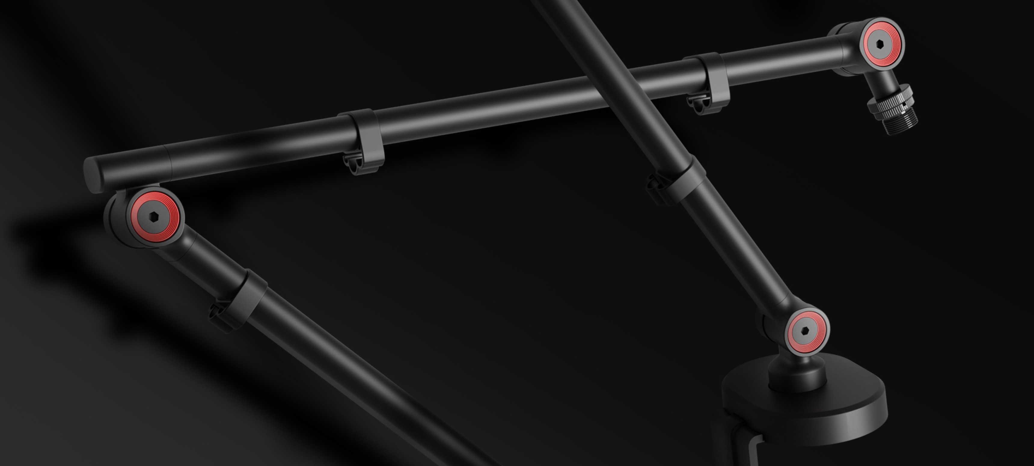 Microphone arm with a headphone holder, featuring adjustable joints and a sturdy base. Black design with red accents