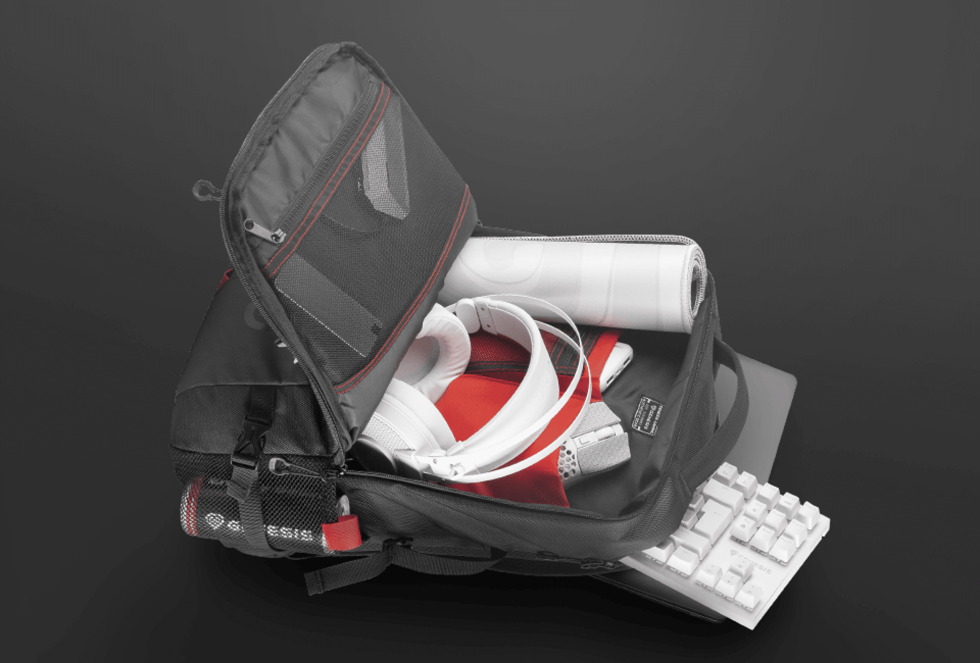 Black Genesis Pallad 410 laptop backpack open, showcasing compartments with headphones, a rolled document, and a keyboard