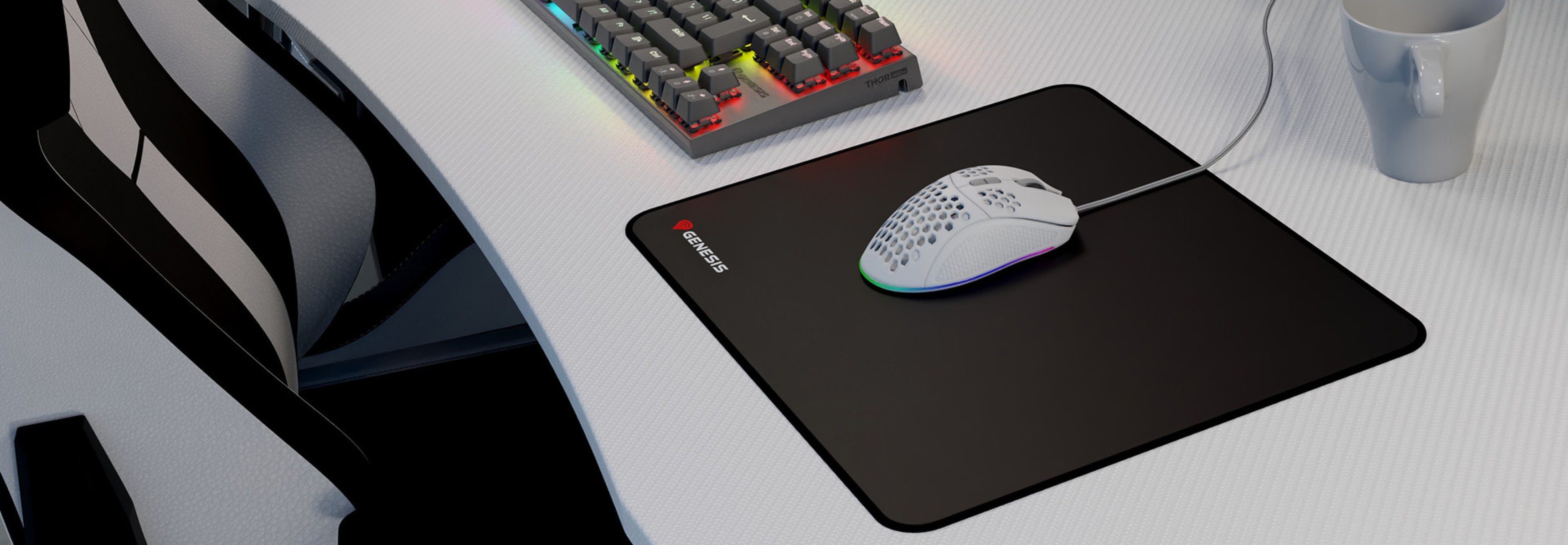 Black mouse pad with Genesis logo, sized 300x250mm, placed on a desk next to a keyboard and a cup