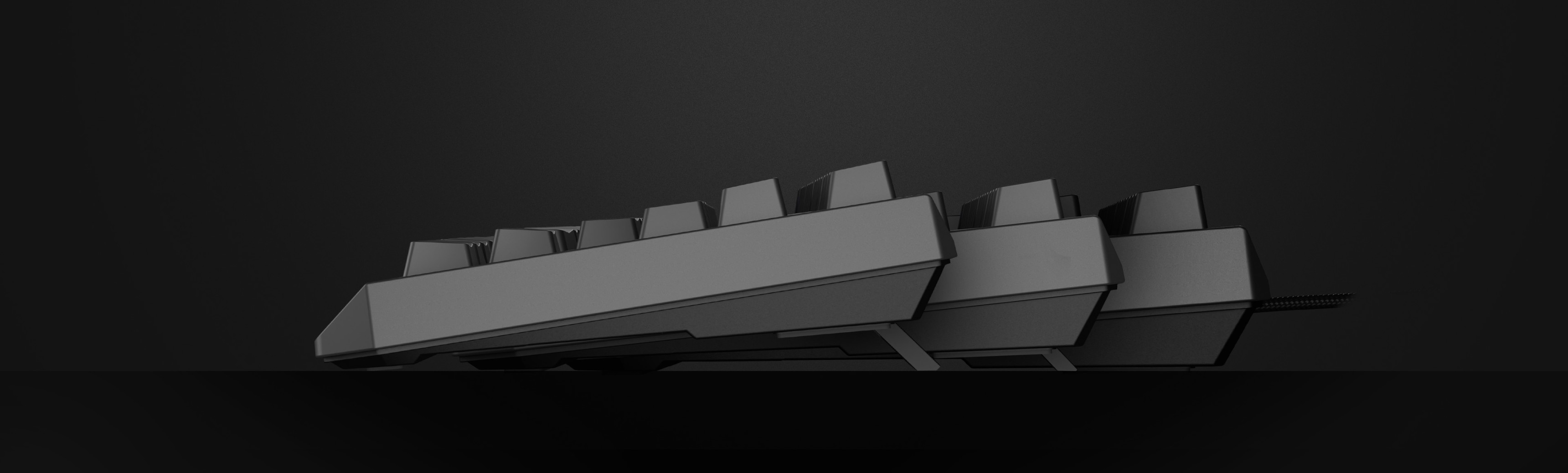 A black mechanical gaming keyboard shown from the side, featuring Outemu Red switches and a compact TKL layout