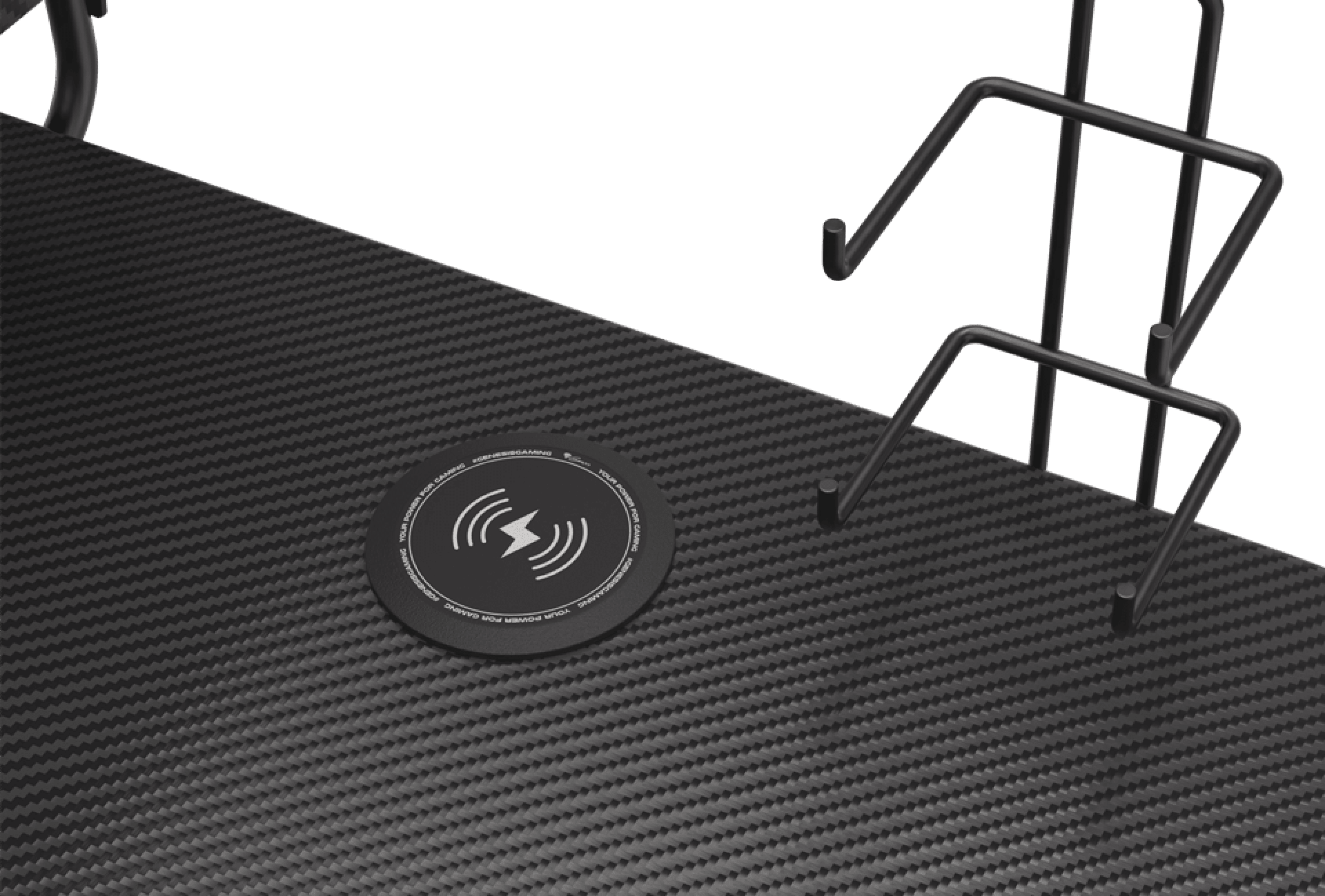 Close-up of the Genesis Holm 300 RGB gaming desk, featuring a wireless charging pad on a textured black surface