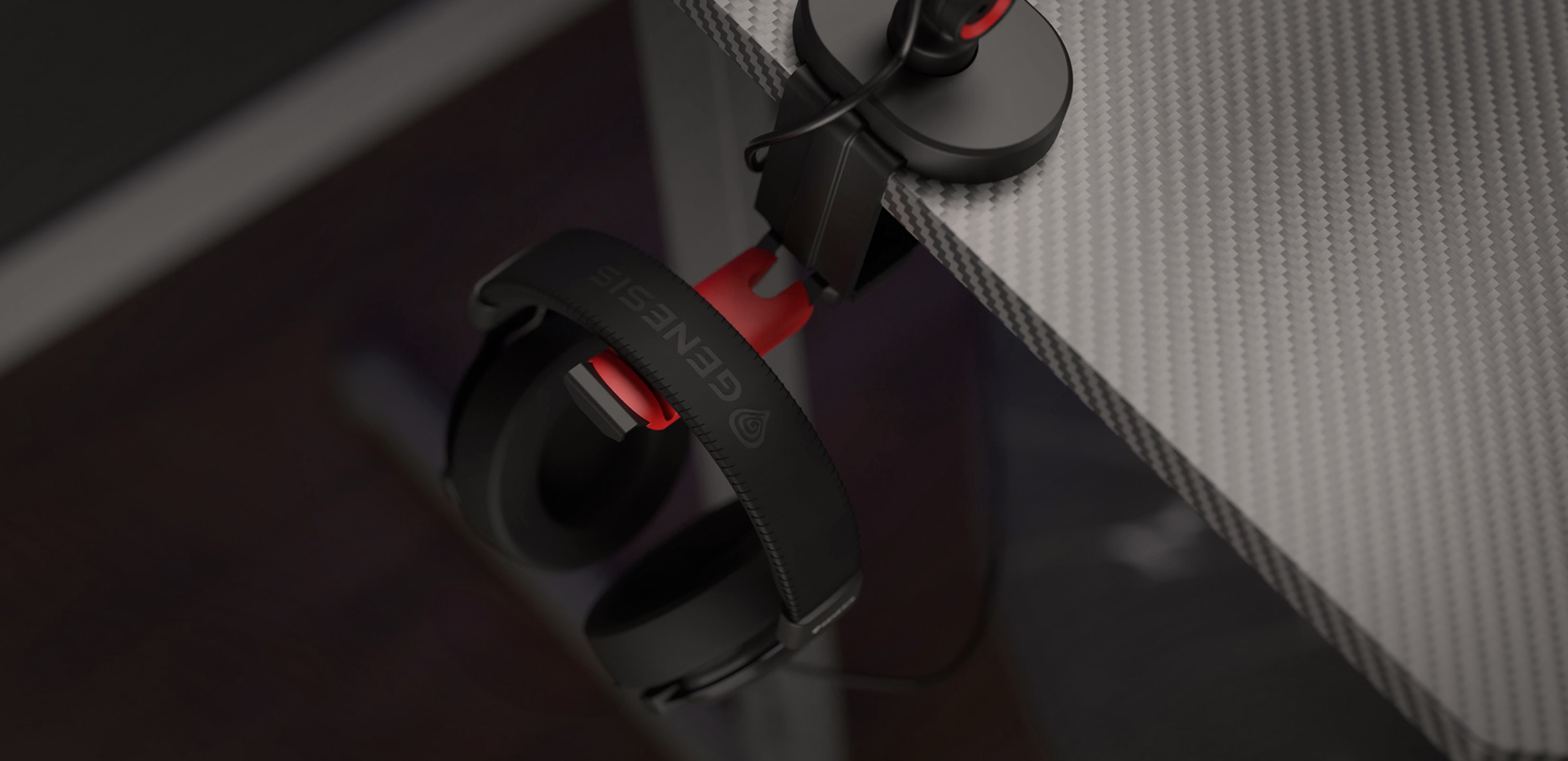 Microphone arm with a headset hanger, showing a headset with red accents attached to the edge of a desk