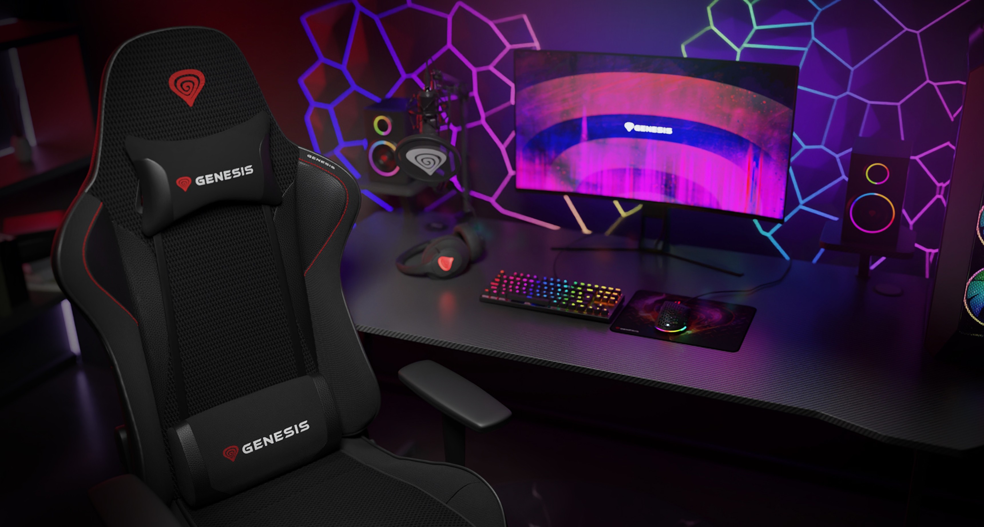 Black Genesis Nitro 440 G2 gaming chair with mesh fabric, placed beside a colorful gaming setup featuring a monitor and RGB keyboard