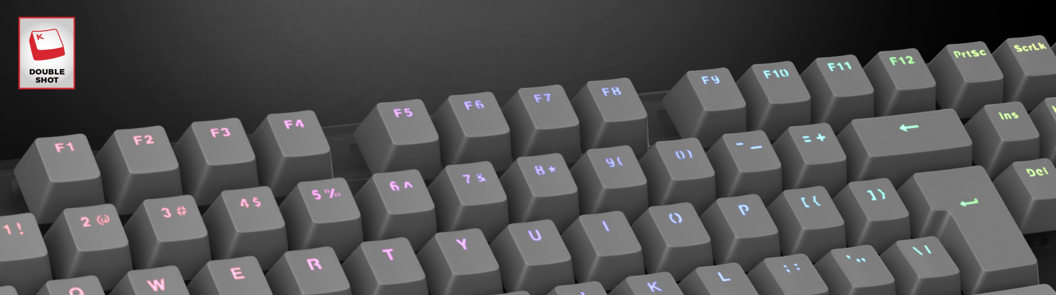 Gray double-shot keycaps for a keyboard, featuring light-up accents for enhanced visibility and style
