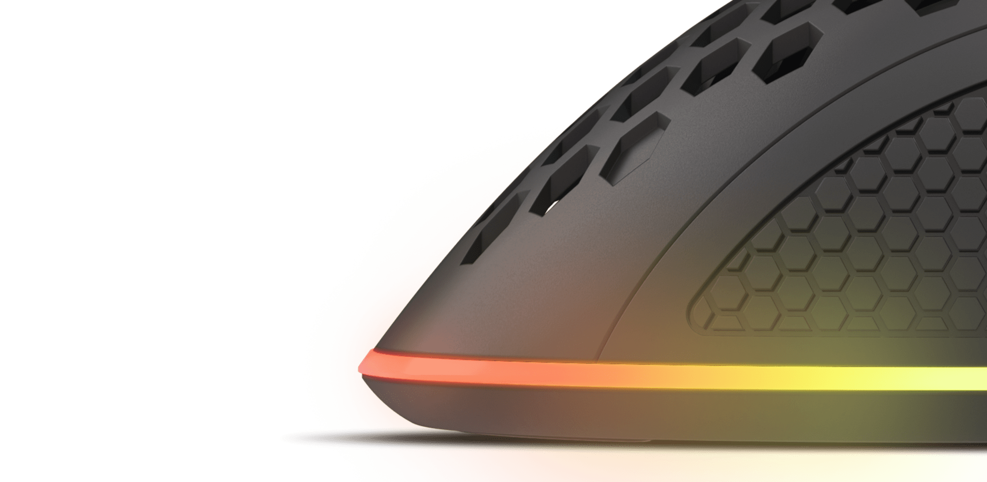 Black Genesis Krypton 555 gaming mouse with RGB lighting and a honeycomb design for improved grip and ventilation