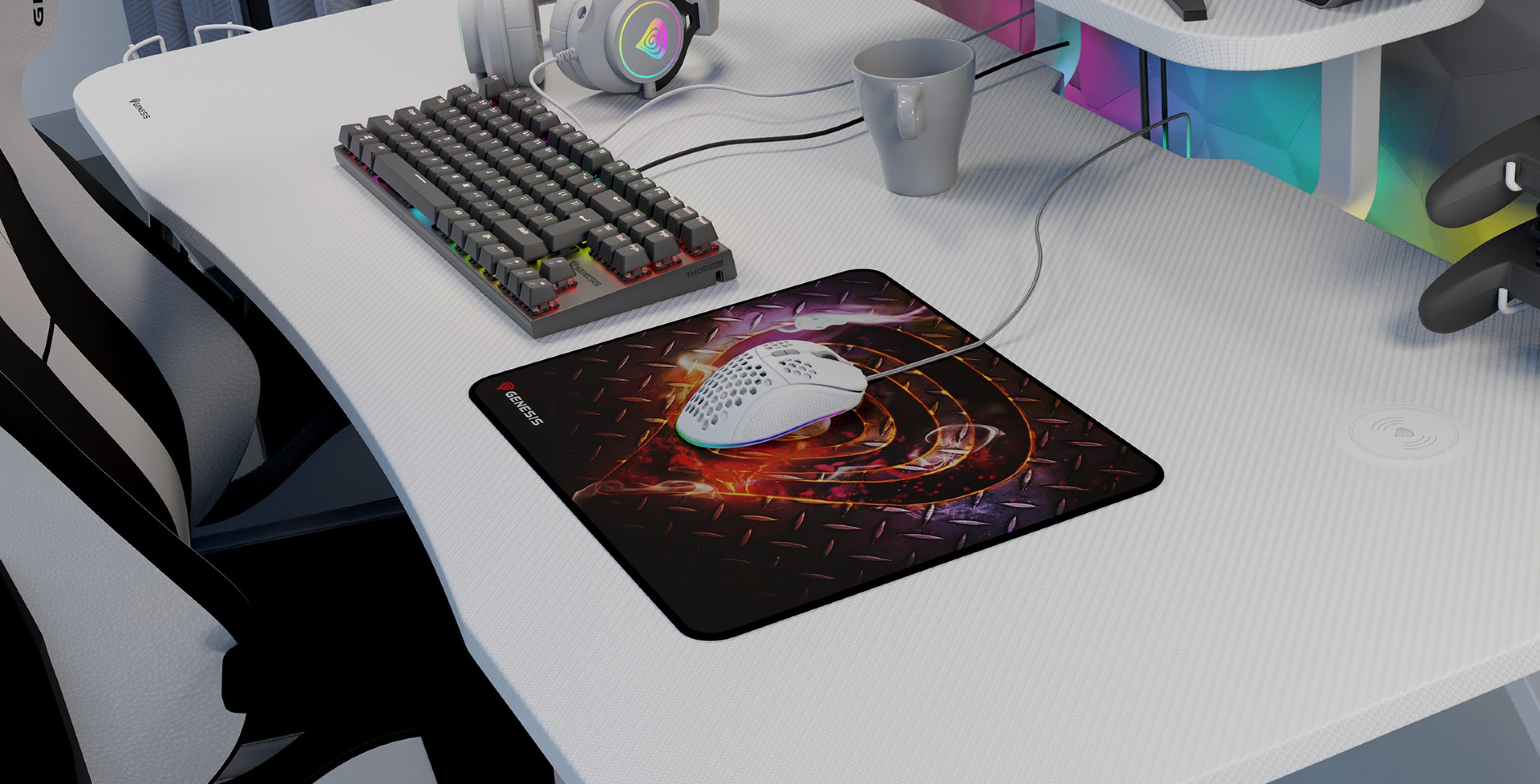 A gaming mouse pad featuring a vibrant design, placed on a sleek desk alongside a keyboard, mouse, and a cup