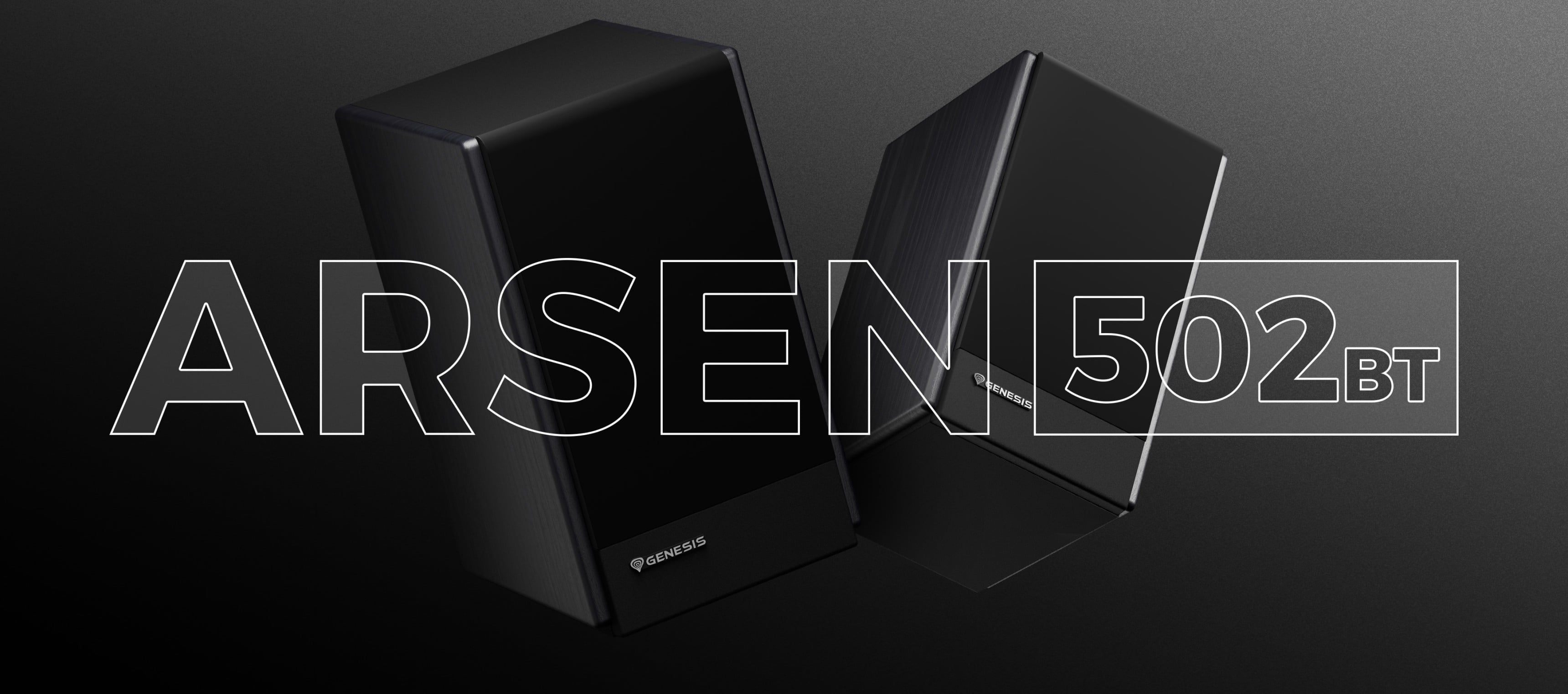 Two black speakers placed at an angle against a dark background.
