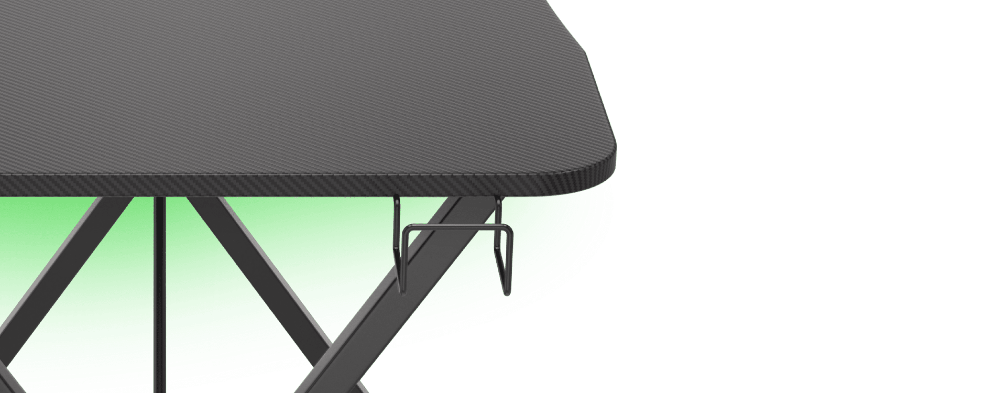 Black gaming desk with a carbon fiber finish and green LED lighting, featuring hooks for accessories on the side