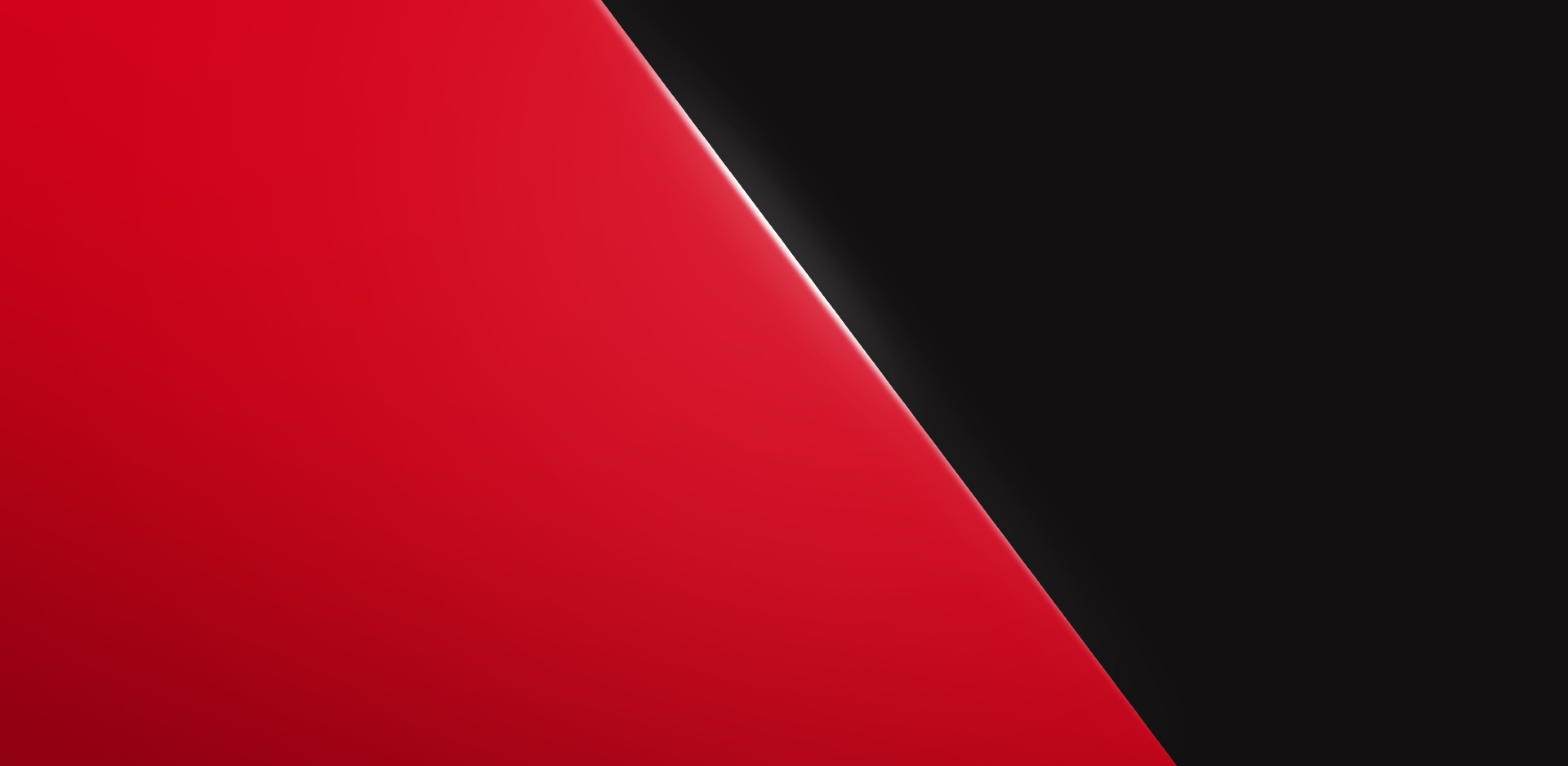 A diagonal split between vibrant red and deep black colors creating a striking contrast.