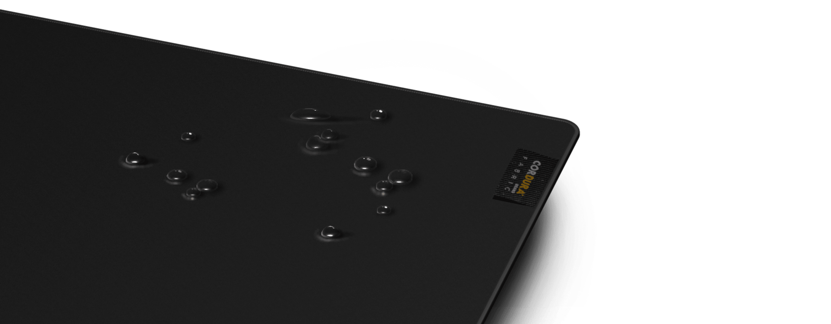 Large black mouse pad with a textured surface, featuring water droplets and a logo label in the corner