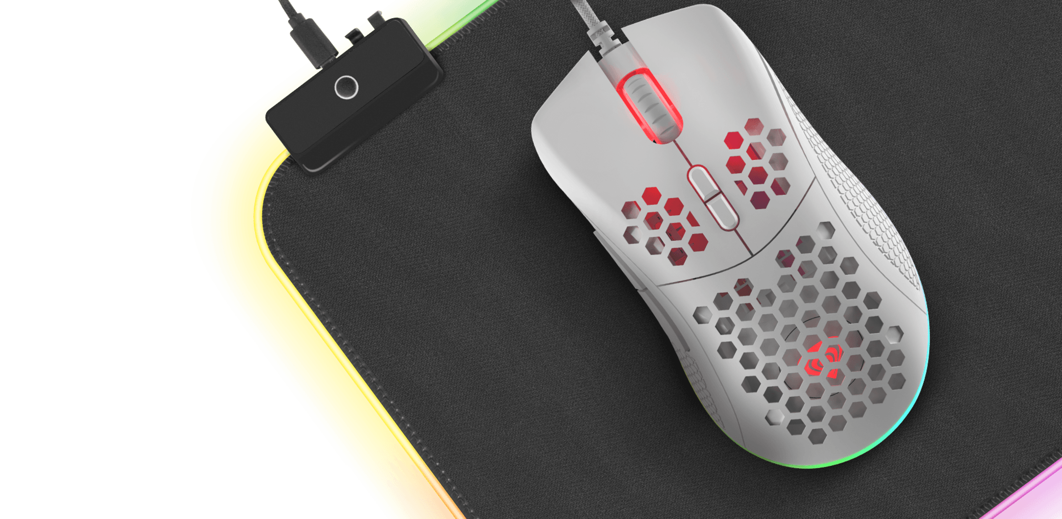 Gaming mouse with a cable and glowing details on a dark surface.