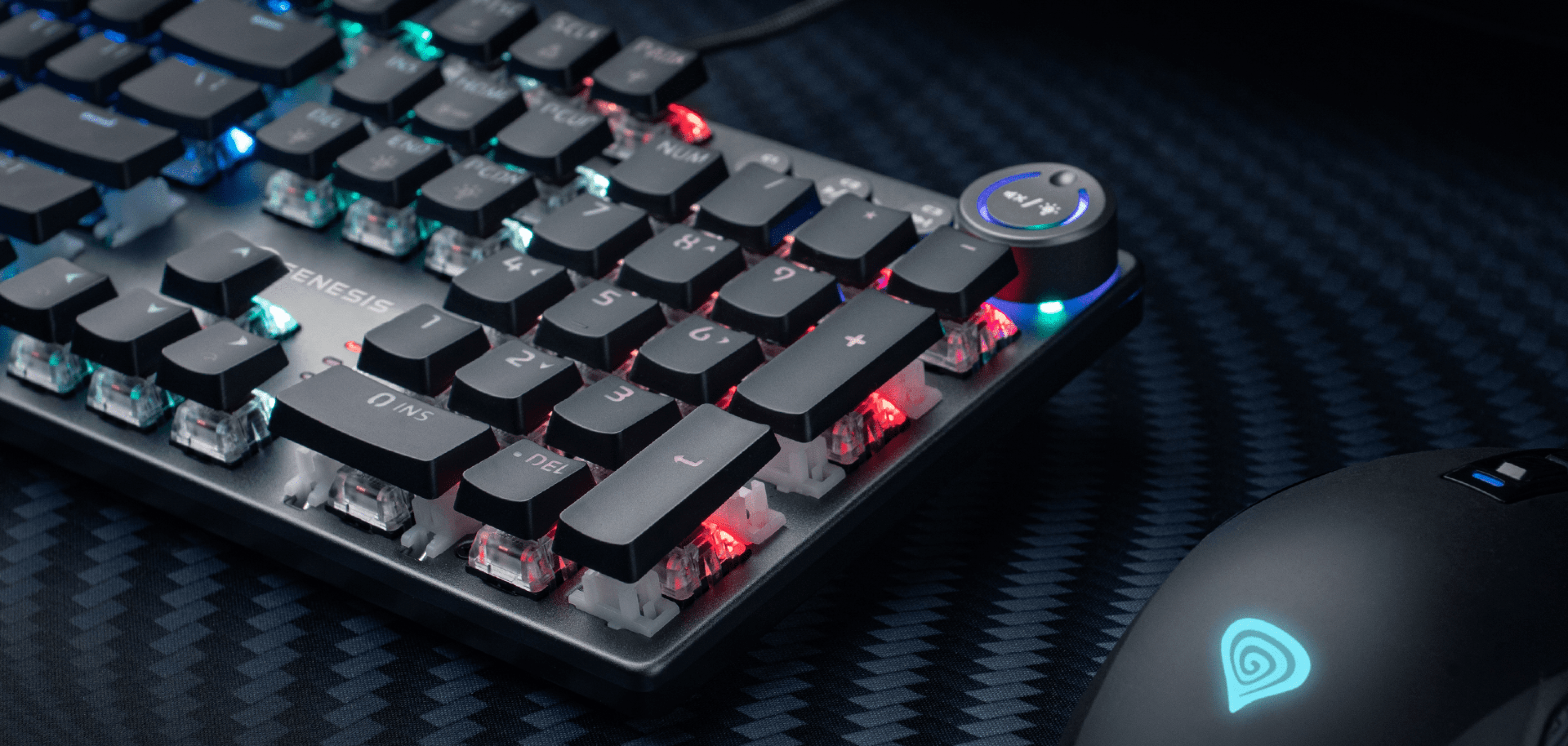 Gaming keyboard with colorful lighting and a gaming mouse on a textured surface.