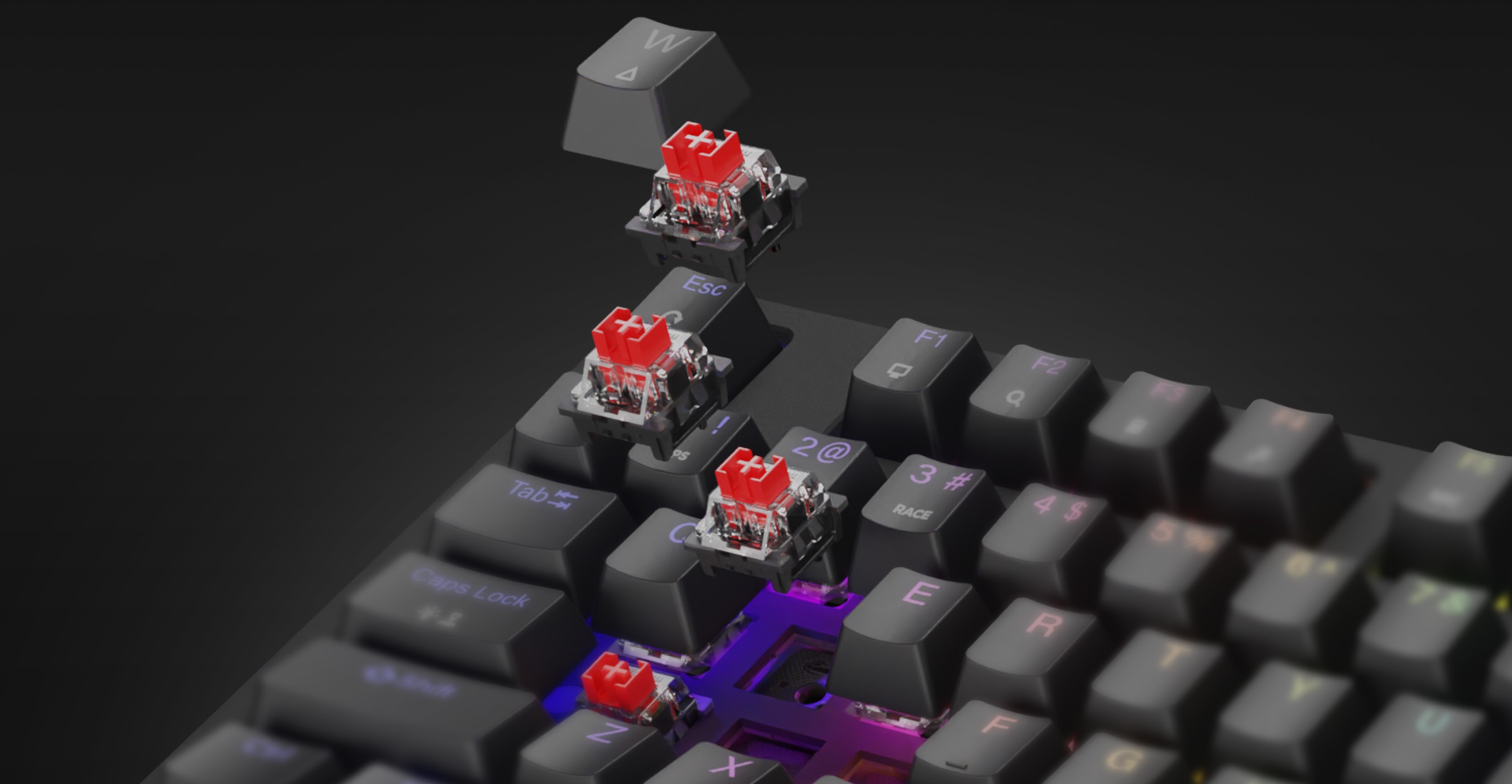 Mechanical gaming keyboard with red switches and rainbow RGB lighting, showcasing hot-swappable keycaps and switches