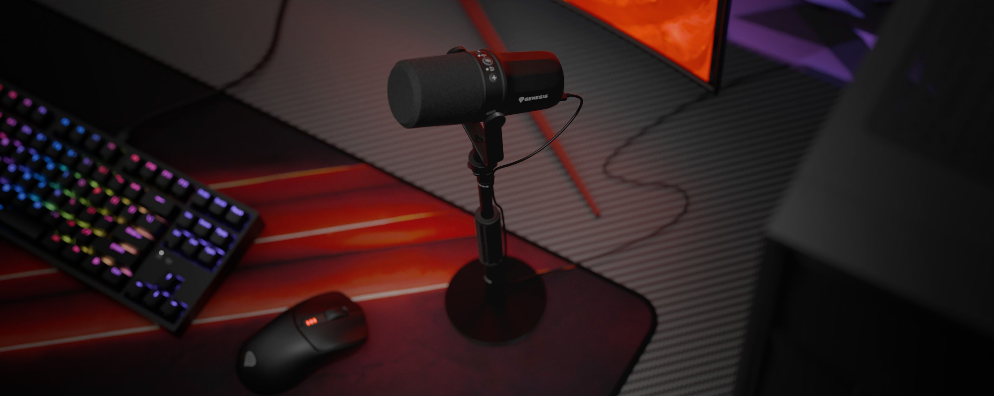 USB and XLR microphone on a stand with a computer keyboard and mouse in the background