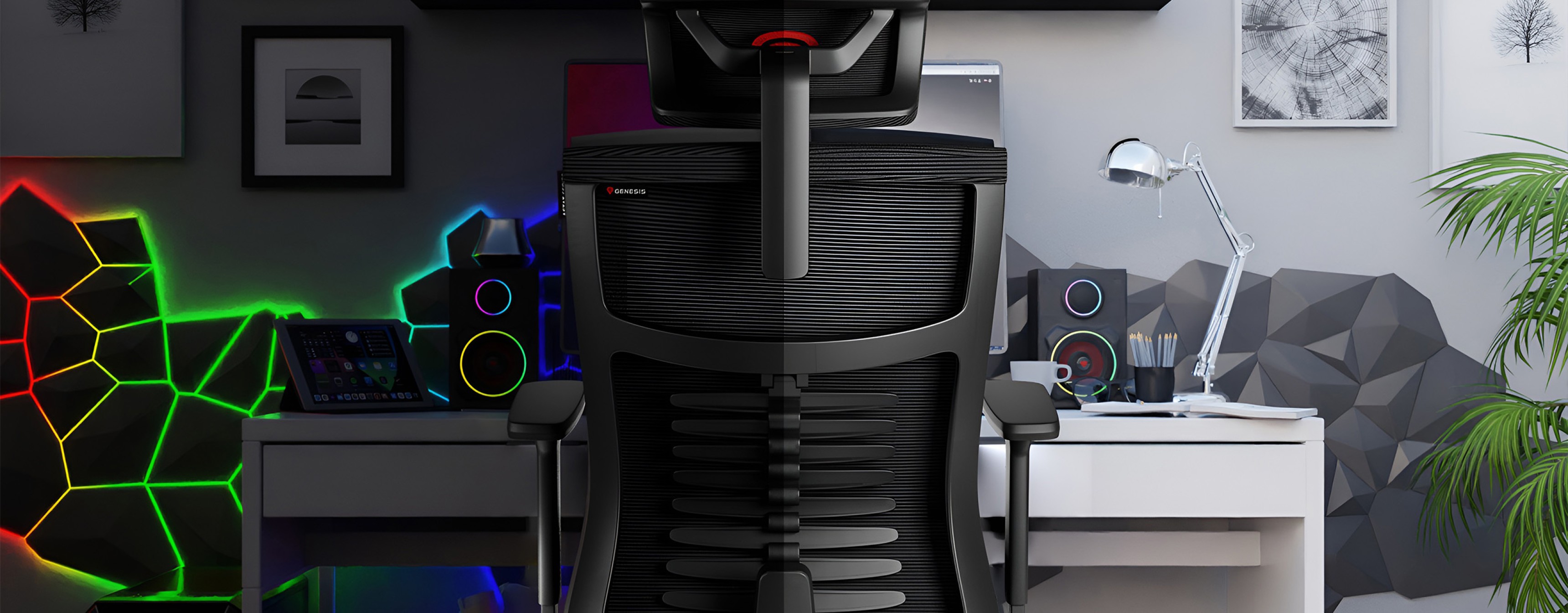 Ergonomic gaming chair in black, positioned in a modern workspace with colorful LED accents and a minimalist desk setup