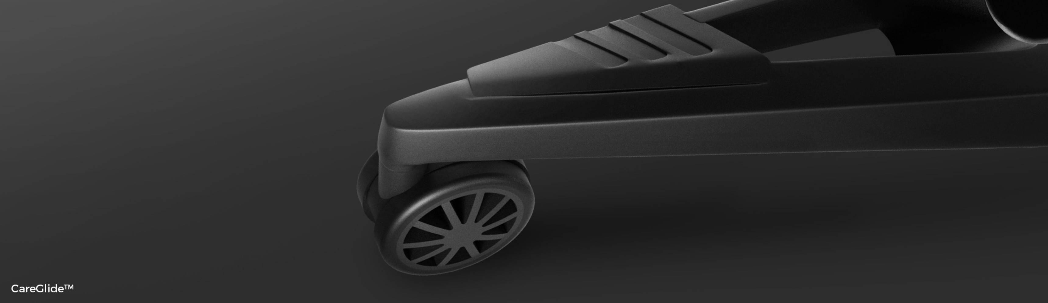 Close-up of the wheel and base of the black Genesis Astat 700 G2 ergonomic chair, showcasing its sleek, modern design
