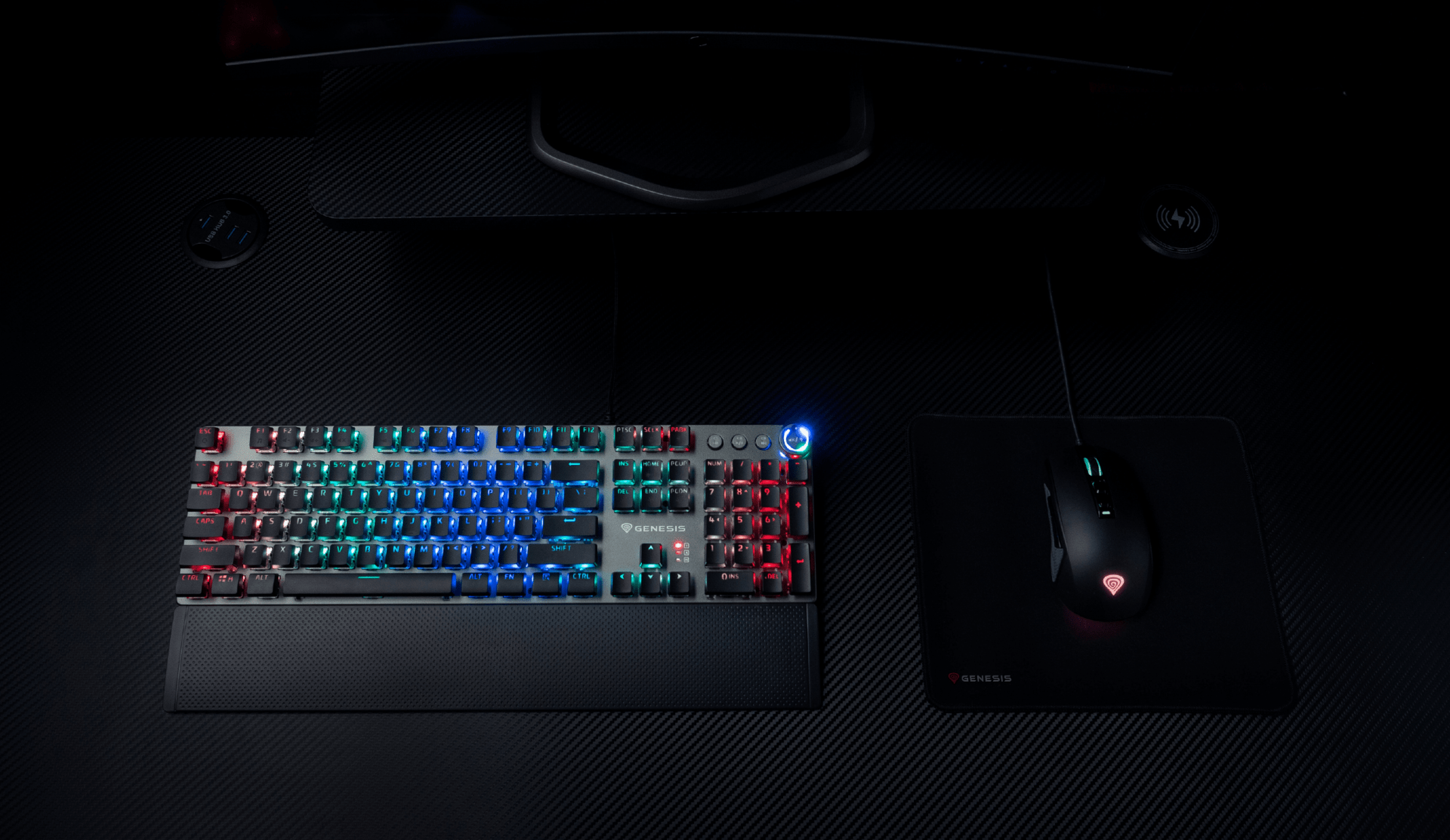 Keyboard with colorful backlighting and a gaming mouse on a textured surface.