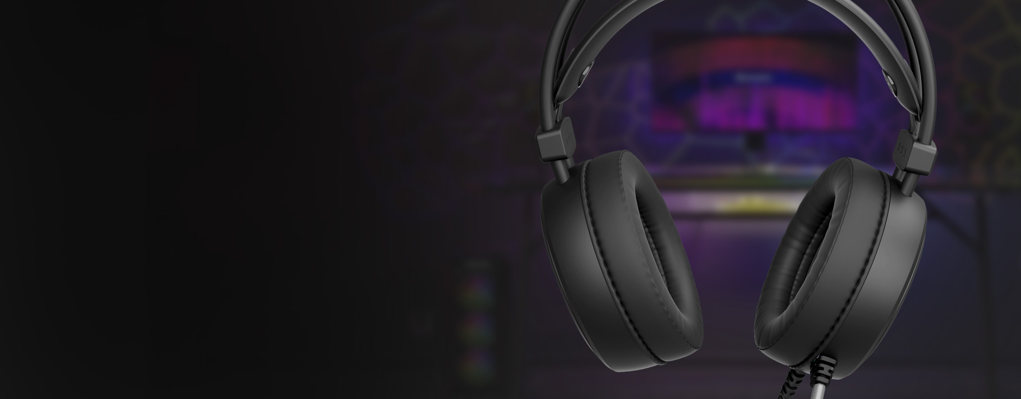 Headphones with large ear cups and a connection cable, set against a colorful background.