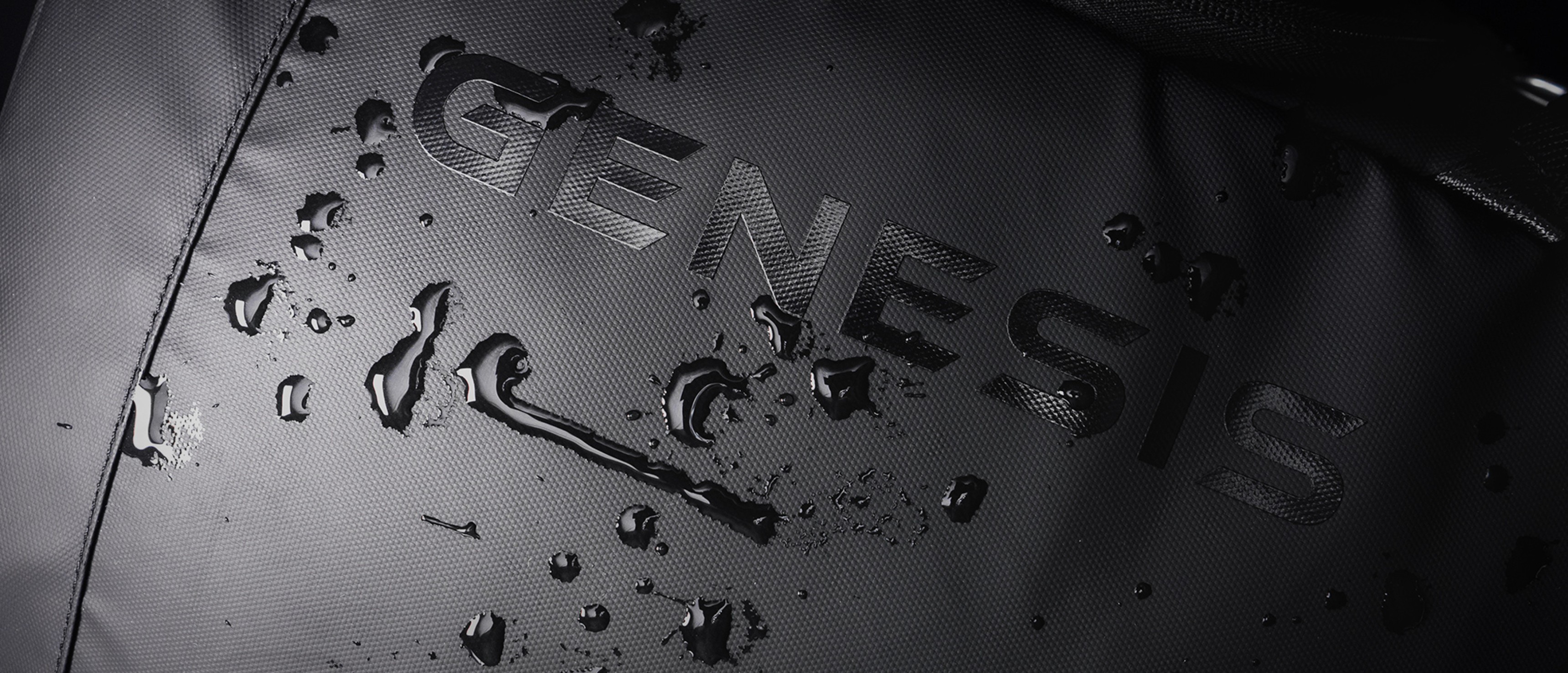 Close-up of the Genesis Pallad 420 laptop backpack, featuring a black surface with water droplets and the brand logo