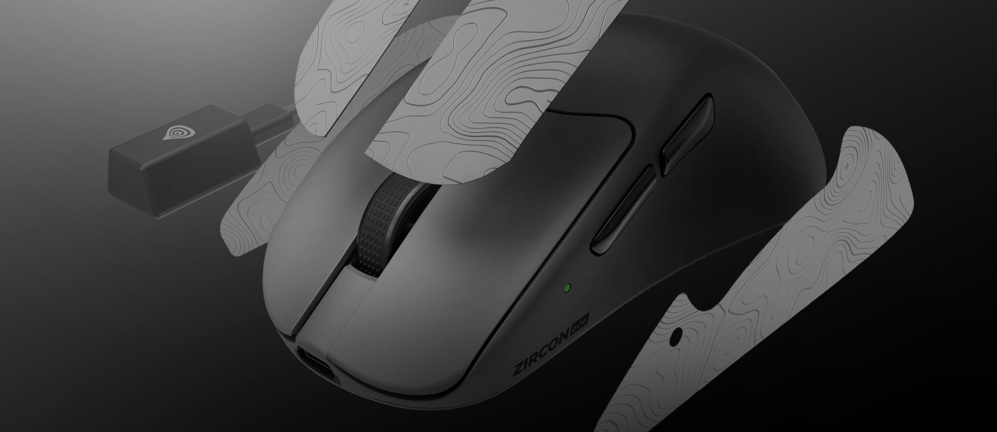 Gaming mouse with a textured surface and a small wireless connection adapter.