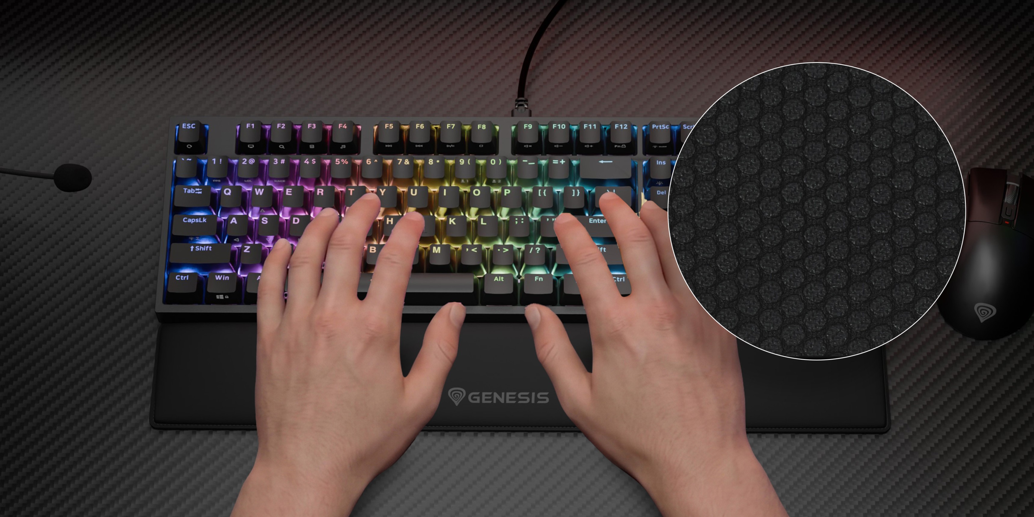 Gaming keyboard with colorful illuminated keys and a hand positioning on the keys.