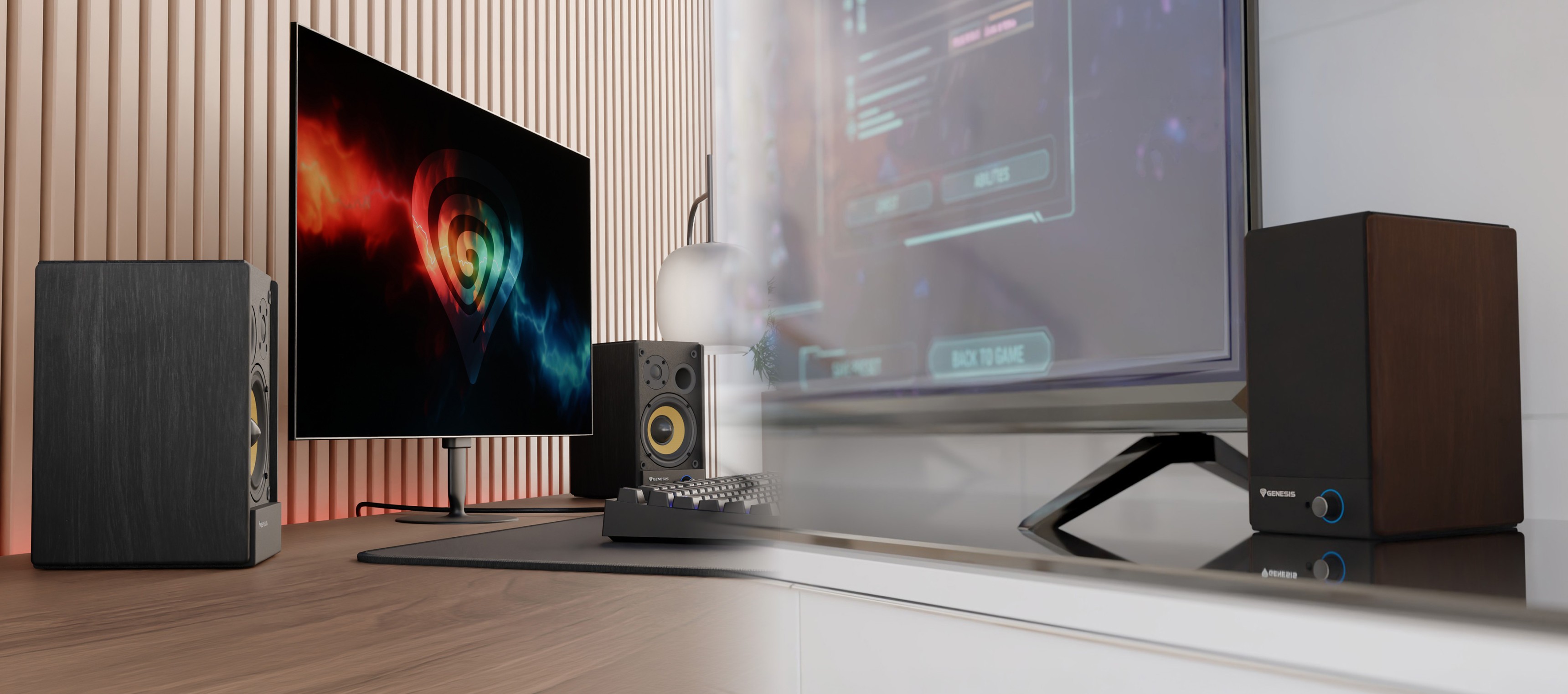 Desktop setup featuring two speakers, a monitor, and a controller on a sleek surface.